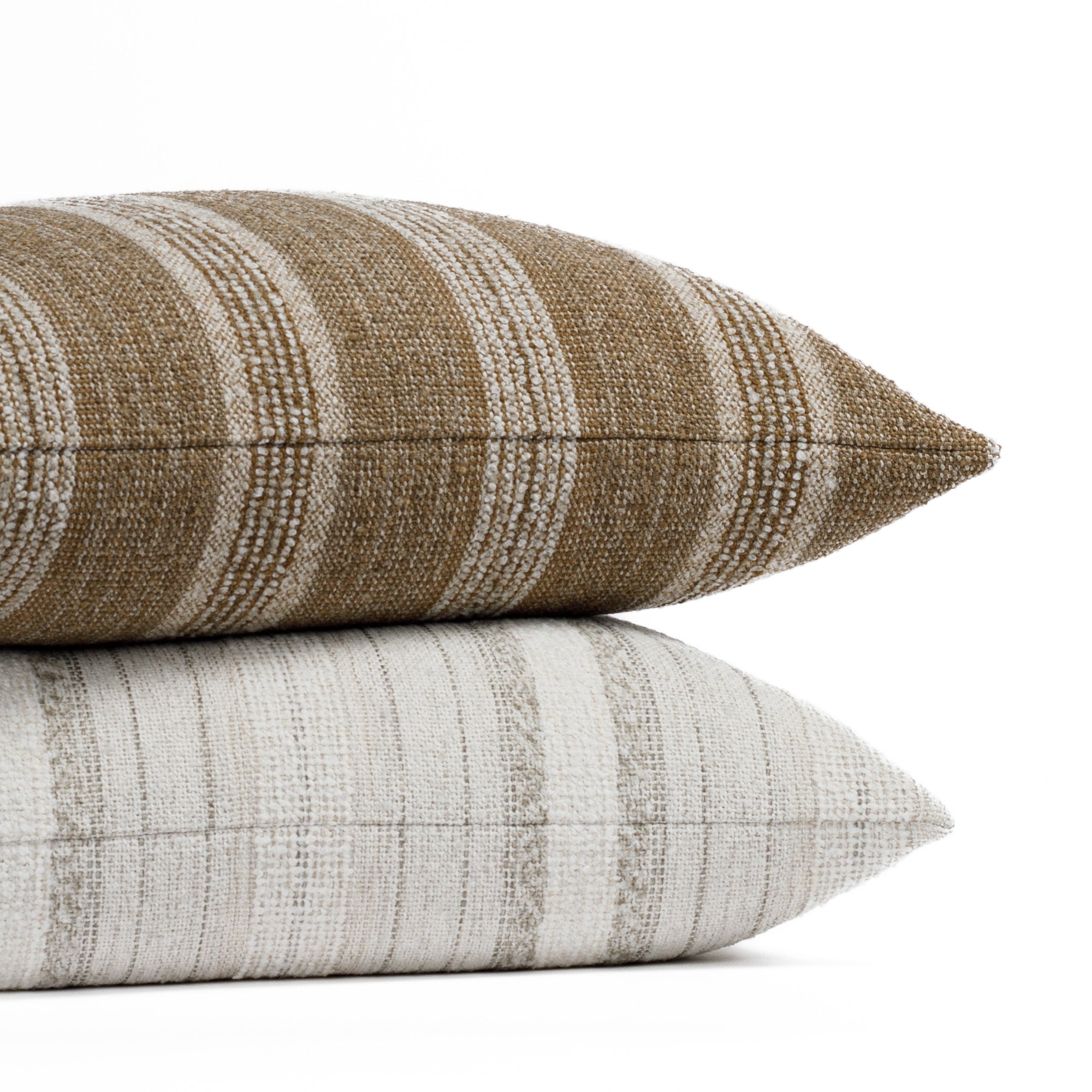Two textured, neutral striped throw pillows from Tonic Living.