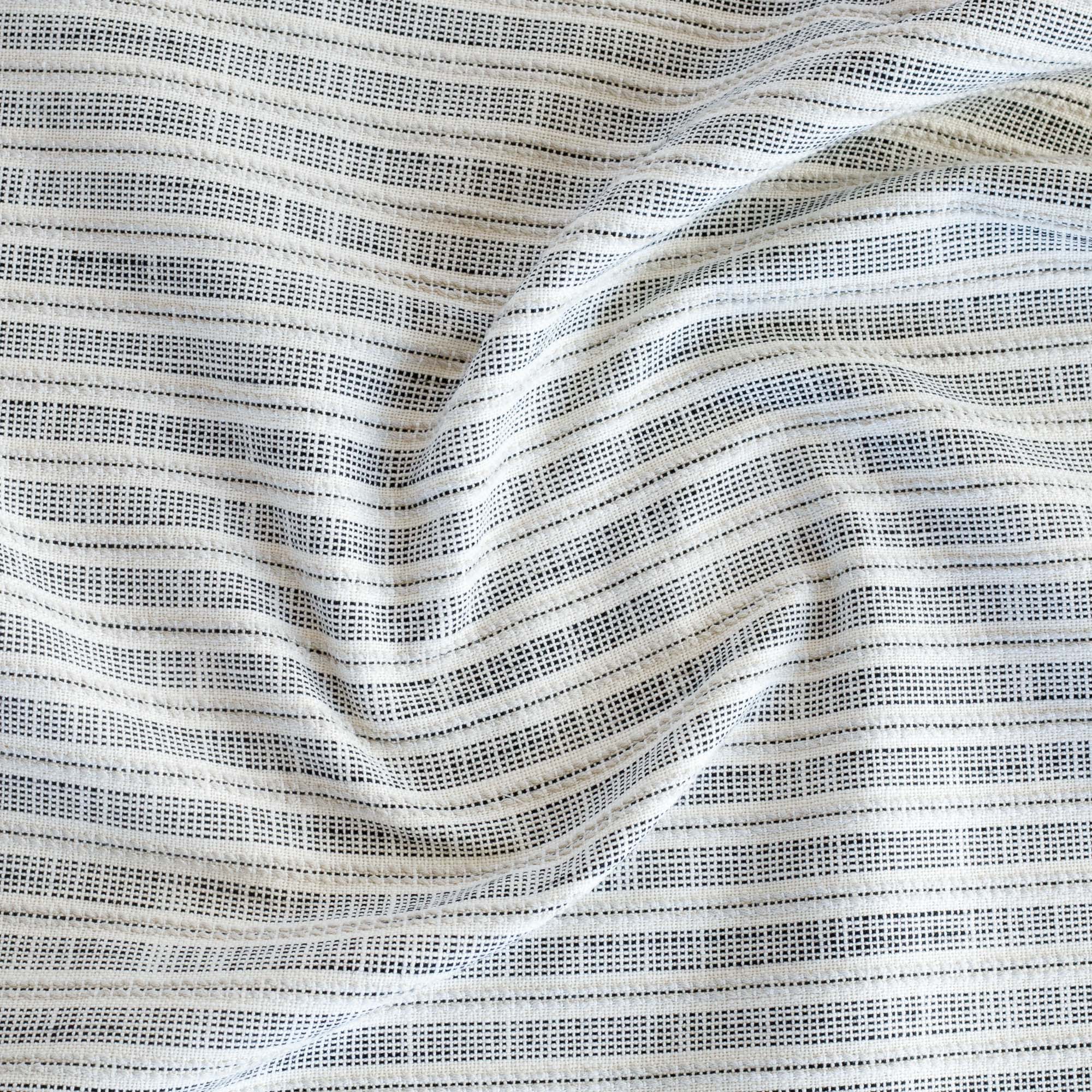 a white and black ticking stripe outdoor upholstery fabric