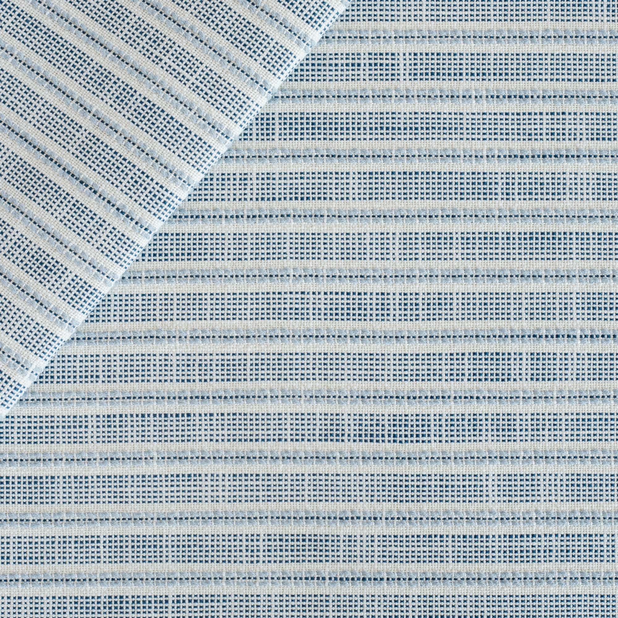 a  white, indigo and chambray blue stripe upholstery fabric