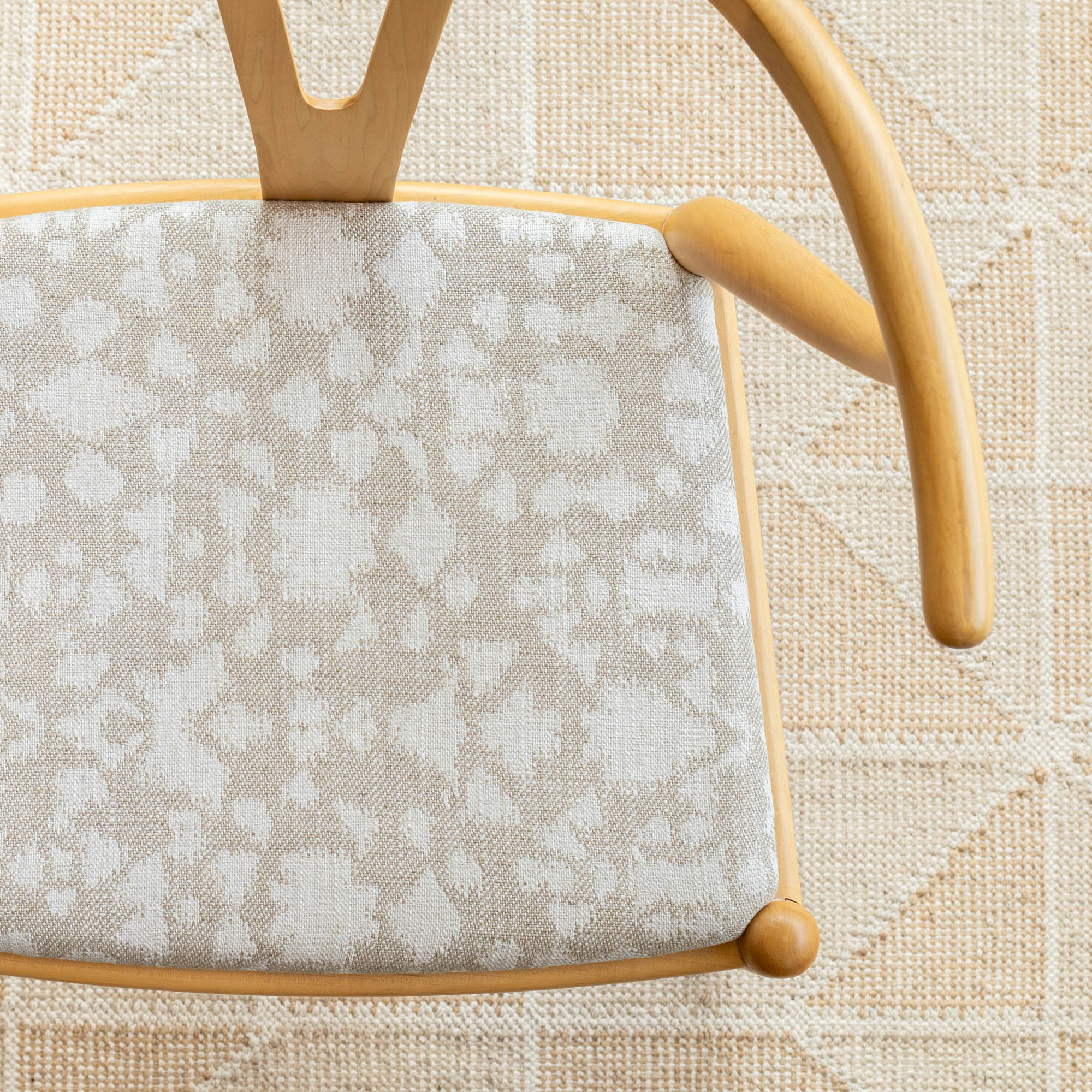 a taupe gray and beige abstract botanical motif pattern upholstered chair seat