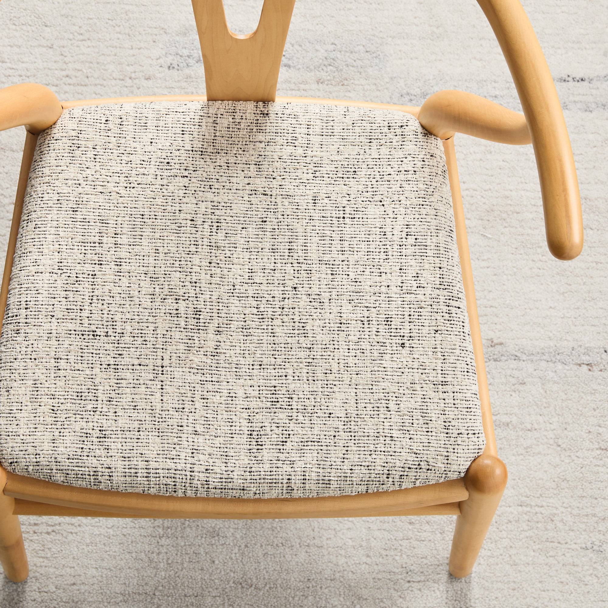 Dining chair in Atlas Fabric Salt & Pepper, textured off-white and black performance fabric by Tonic Living.