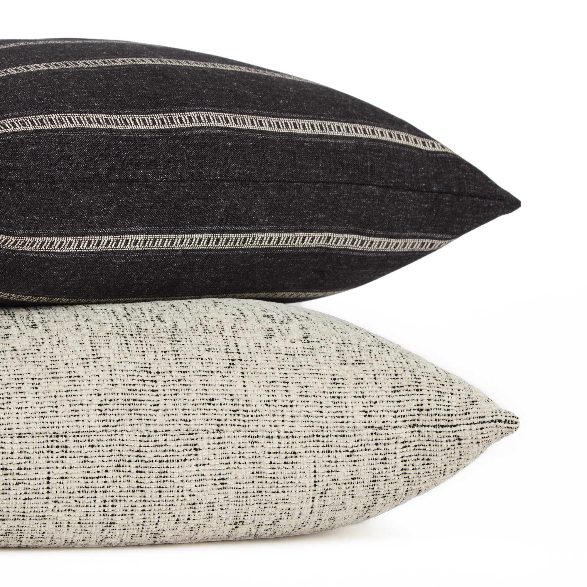 Atlas 22x22 pillow stacked with Brunswick Black & White stripe toss pillow, indoor-outdoor by Tonic Living.