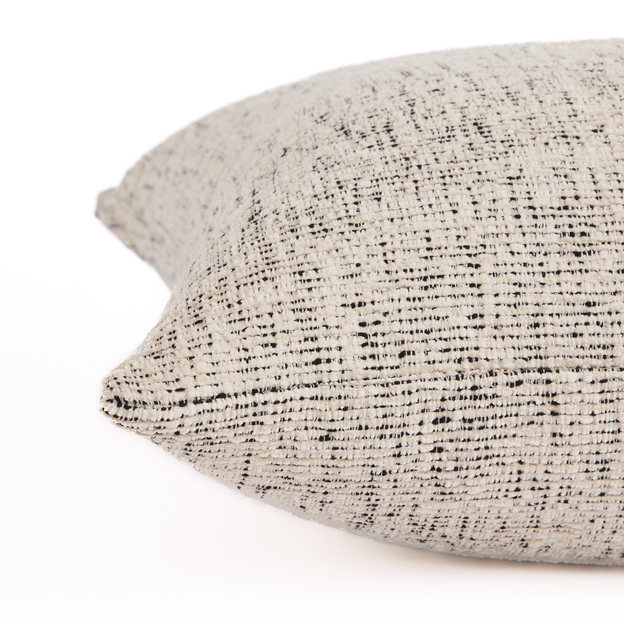 Detailed side view of Atlas 22x22 indoor-outdoor pillow, off-white and black textured stripe fabric, Tonic Living.