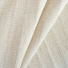 a beige and cream neutral tonal textured woven striped upholstery fabric