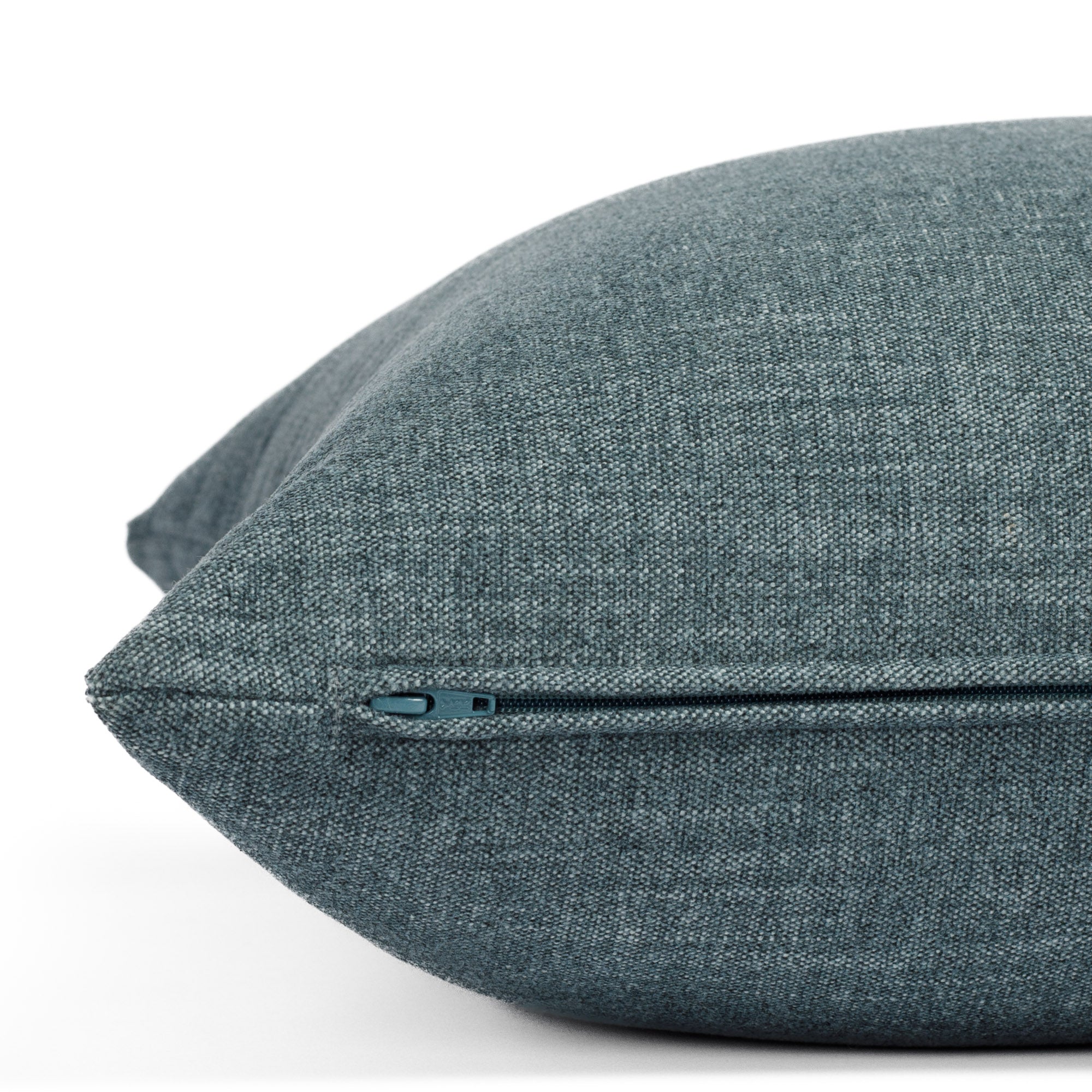 Zipper detail of Bedford Denim toss pillow, Tonic Living chenille fabric in chambray blue tone.