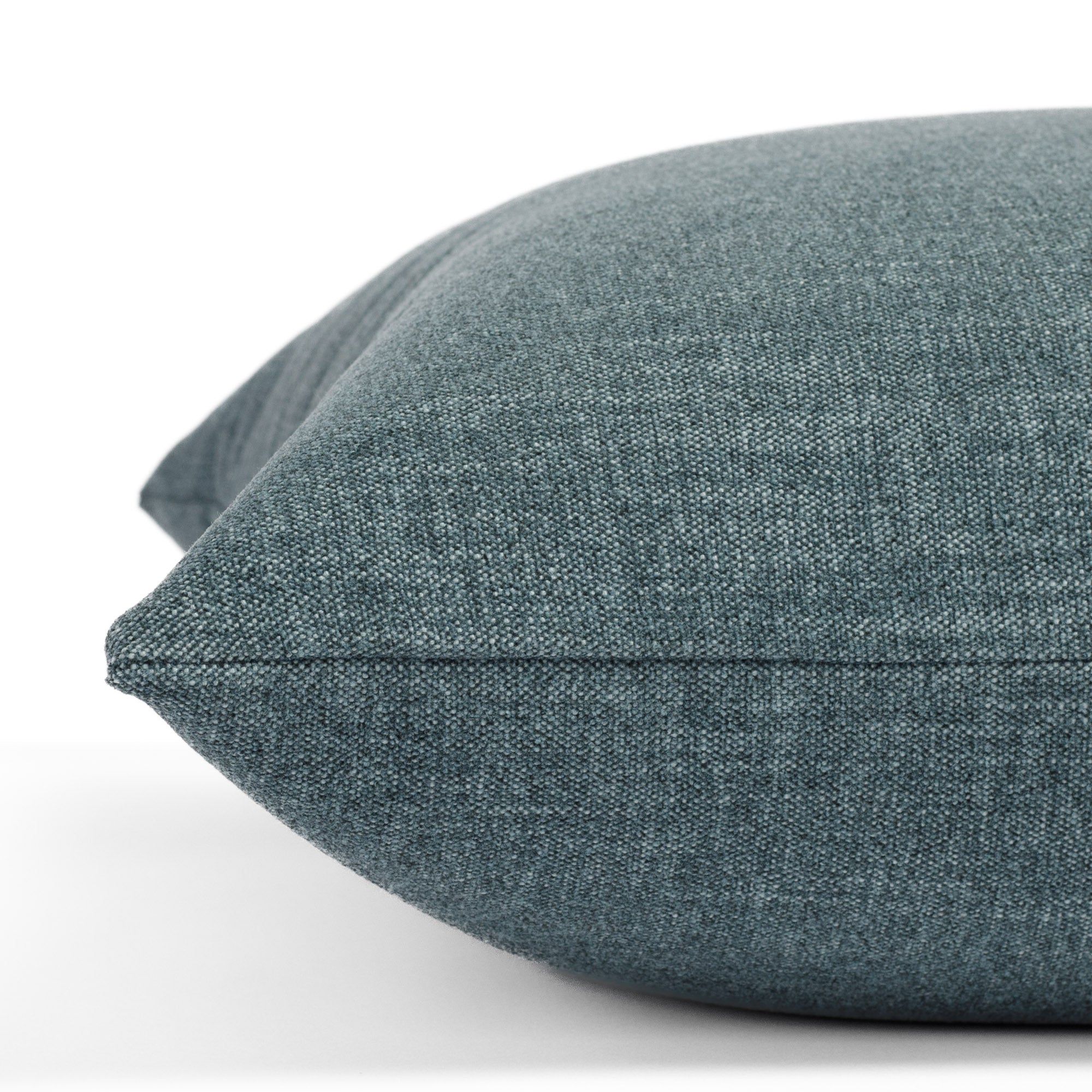 Side angle of Bedford Denim accent pillow in soft indigo blue chenille with a subtle stone-washed finish from Tonic Living.