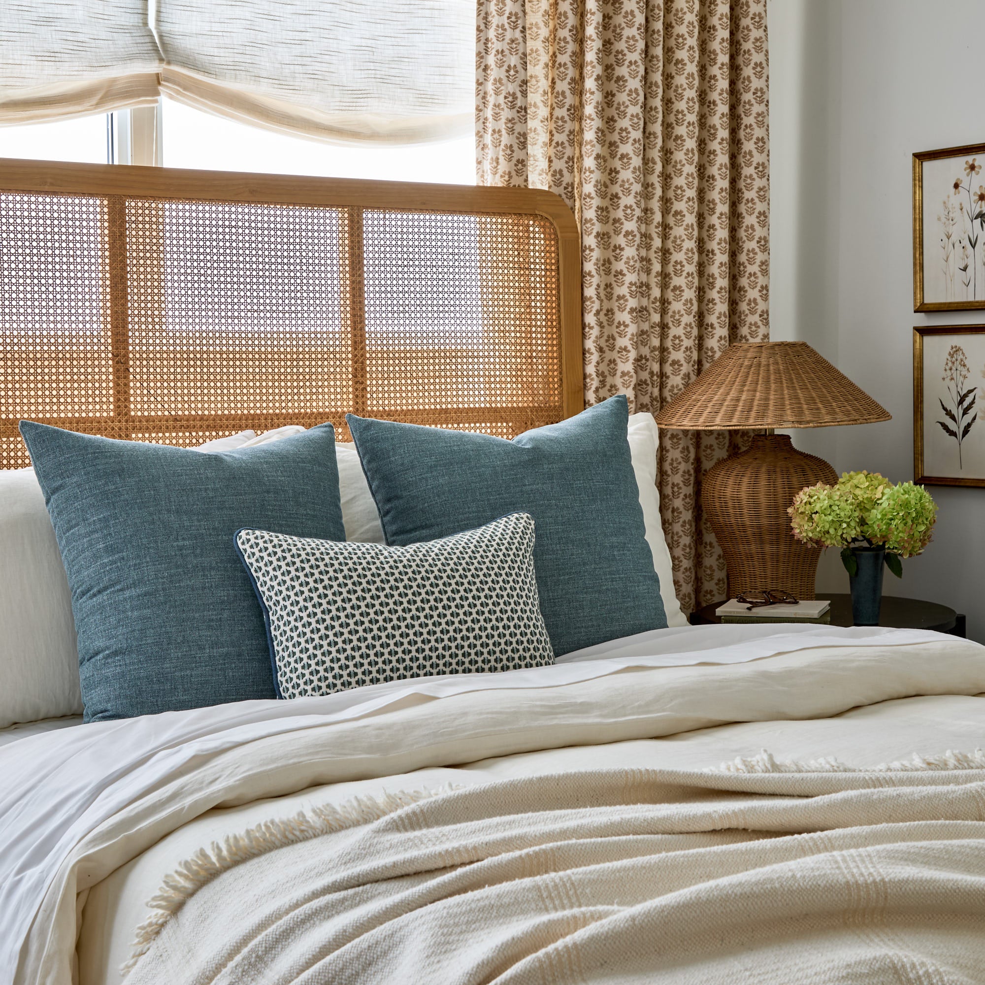 Tonic Living Bedford 22x22 Denim blue throw pillows styled on a bed with Kensington Lagoon lumbar cushion