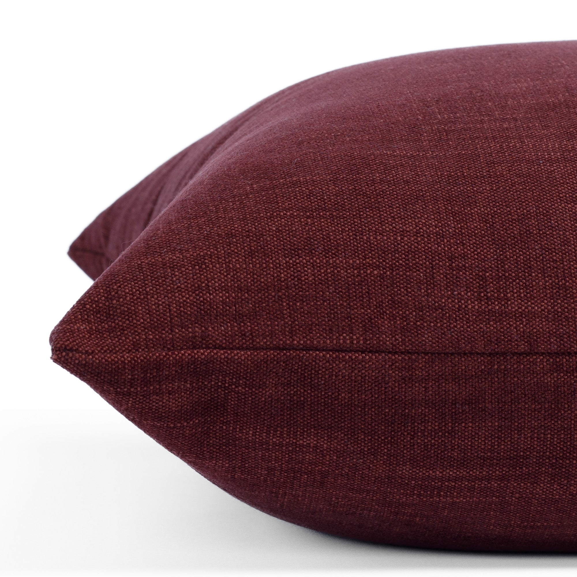 Side angle of Bedford Merlot accent pillow in wine red chenille with subtle stone-washed finish from Tonic Living.