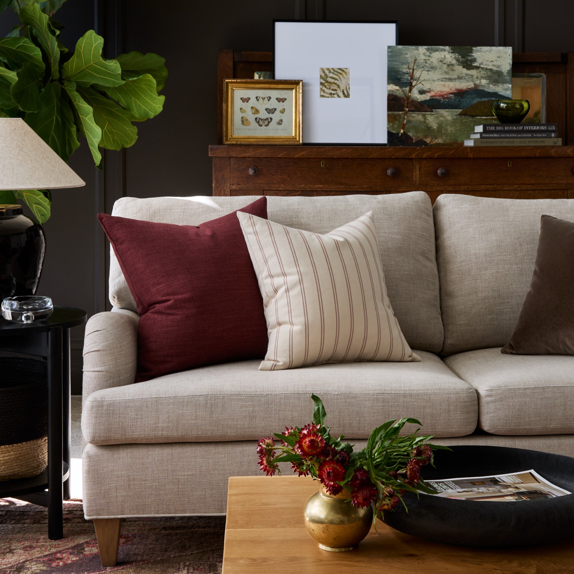 Living room with Bedford Merlot burgundy and Rexton Stripe Merlot red pillows styled on a sofa – Tonic Living