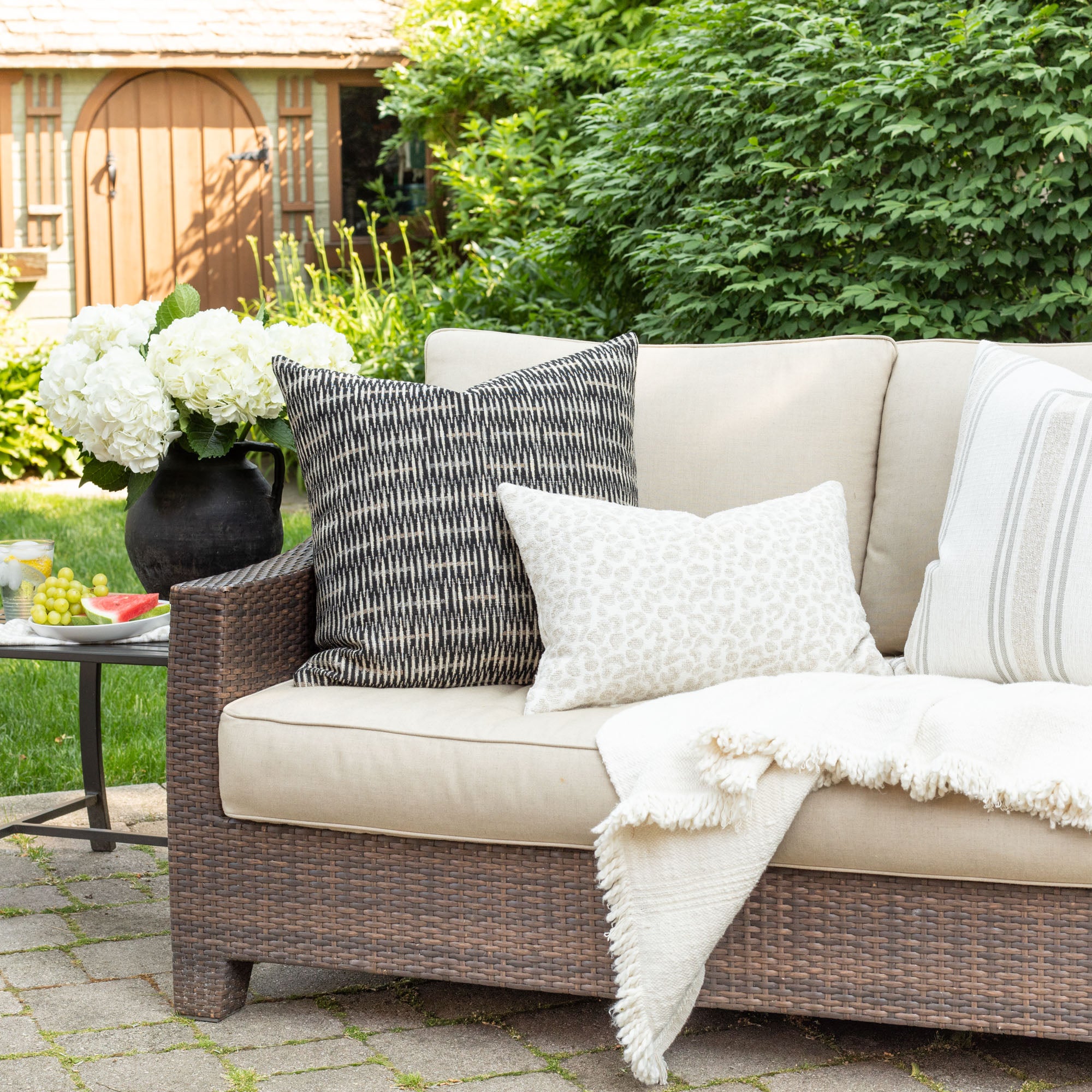 Black and neutral outdoor throw pillows from Tonic Living.