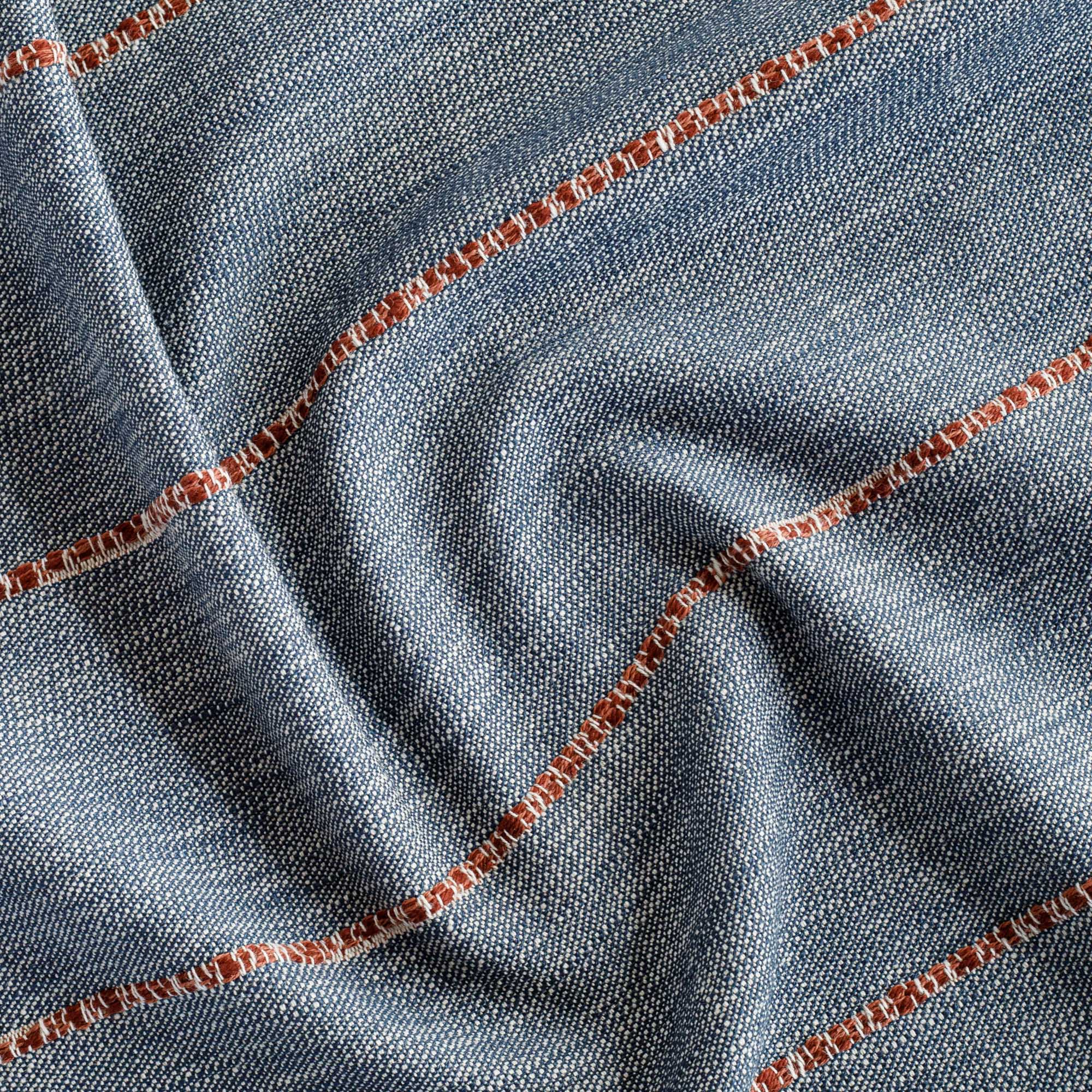 a navy blue home decor fabric with a chunky rust red stripe
