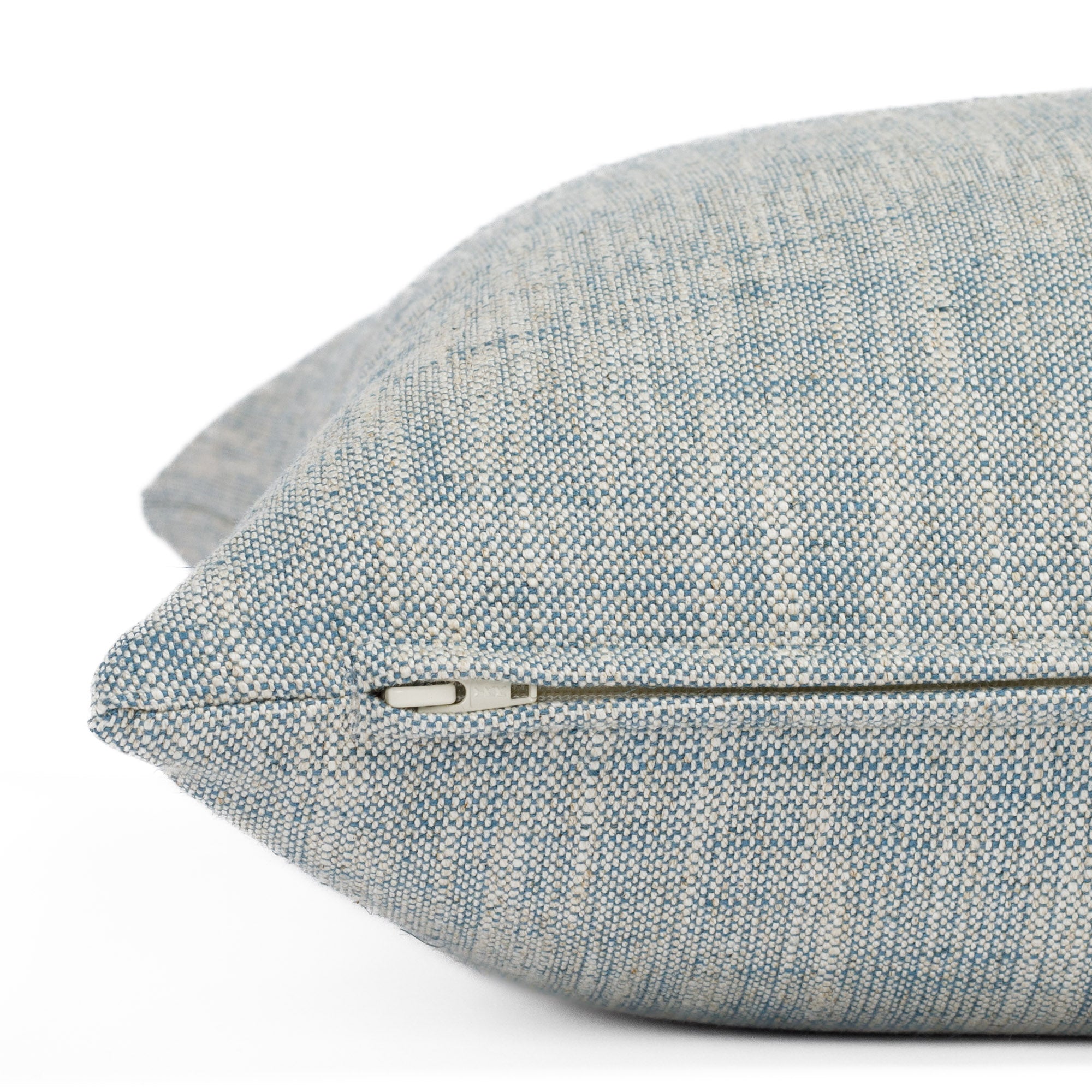Brussels Sky Blue, a slubby textured toss pillow from Tonic Living: close up zipper view.