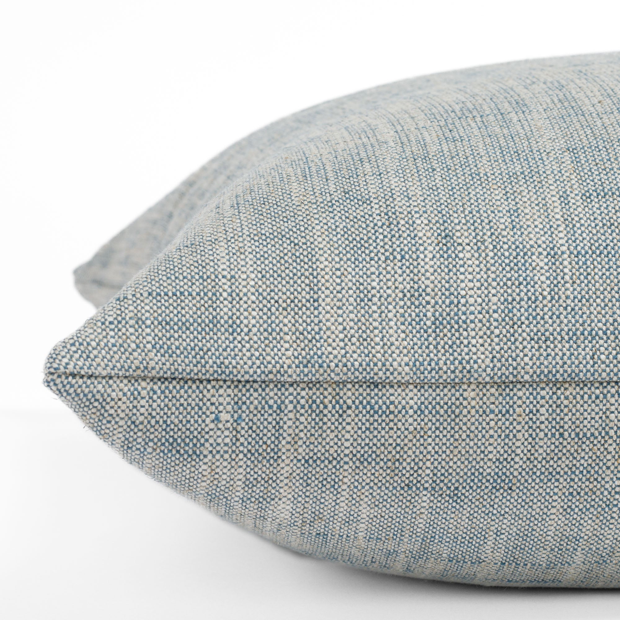 Brussels Sky Blue, a slubby textured designer pillow from Tonic Living: close up side view.