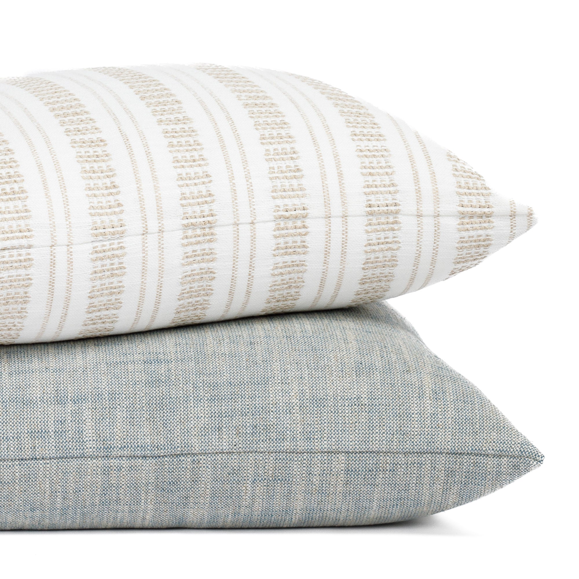Briar White & Beige Stripe pillow paired with the Brussels Sky Blue pillow from Tonic Living.
