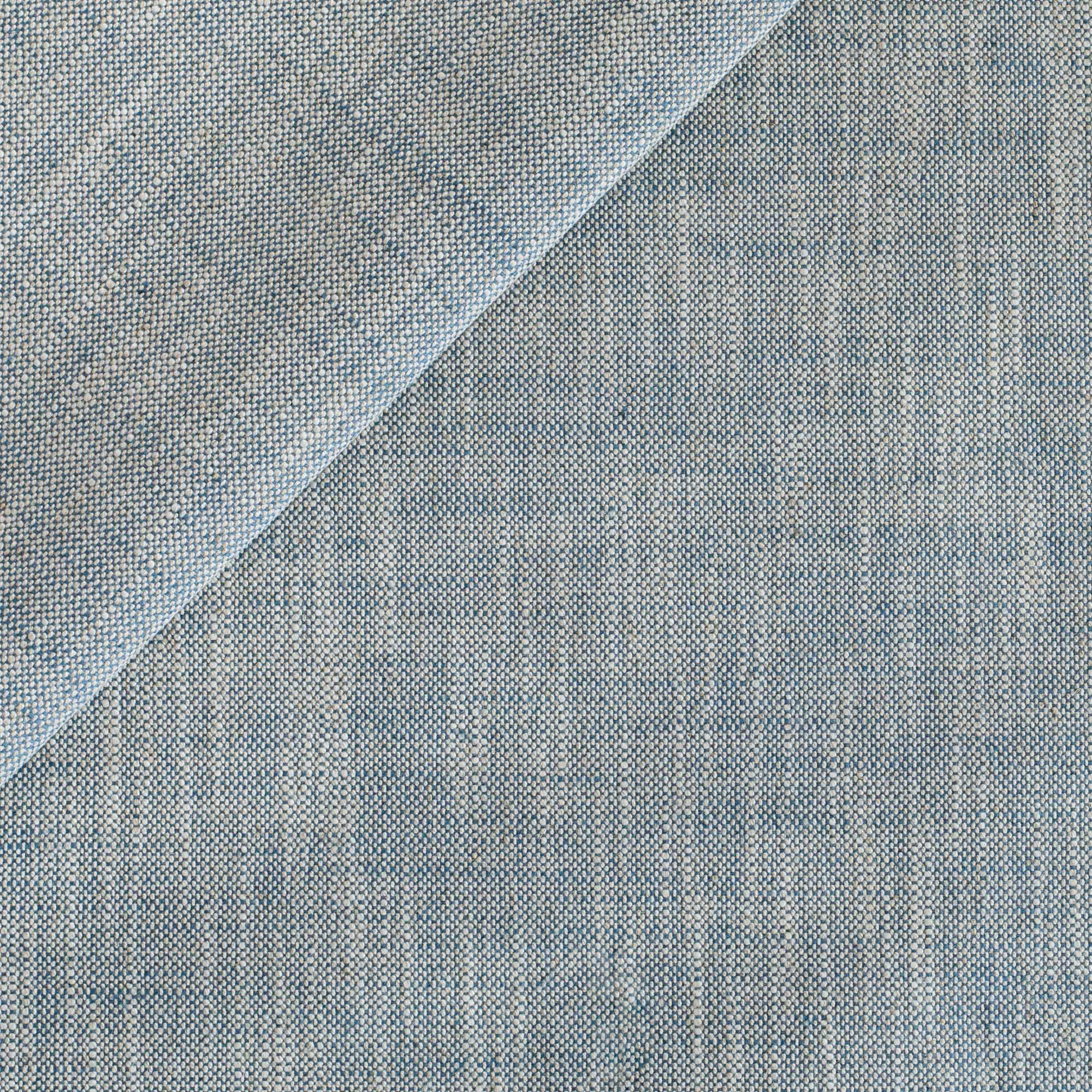 A high-performance upholstery fabric from Tonic Living, with a sky blue and natural beige linen-look texture.
