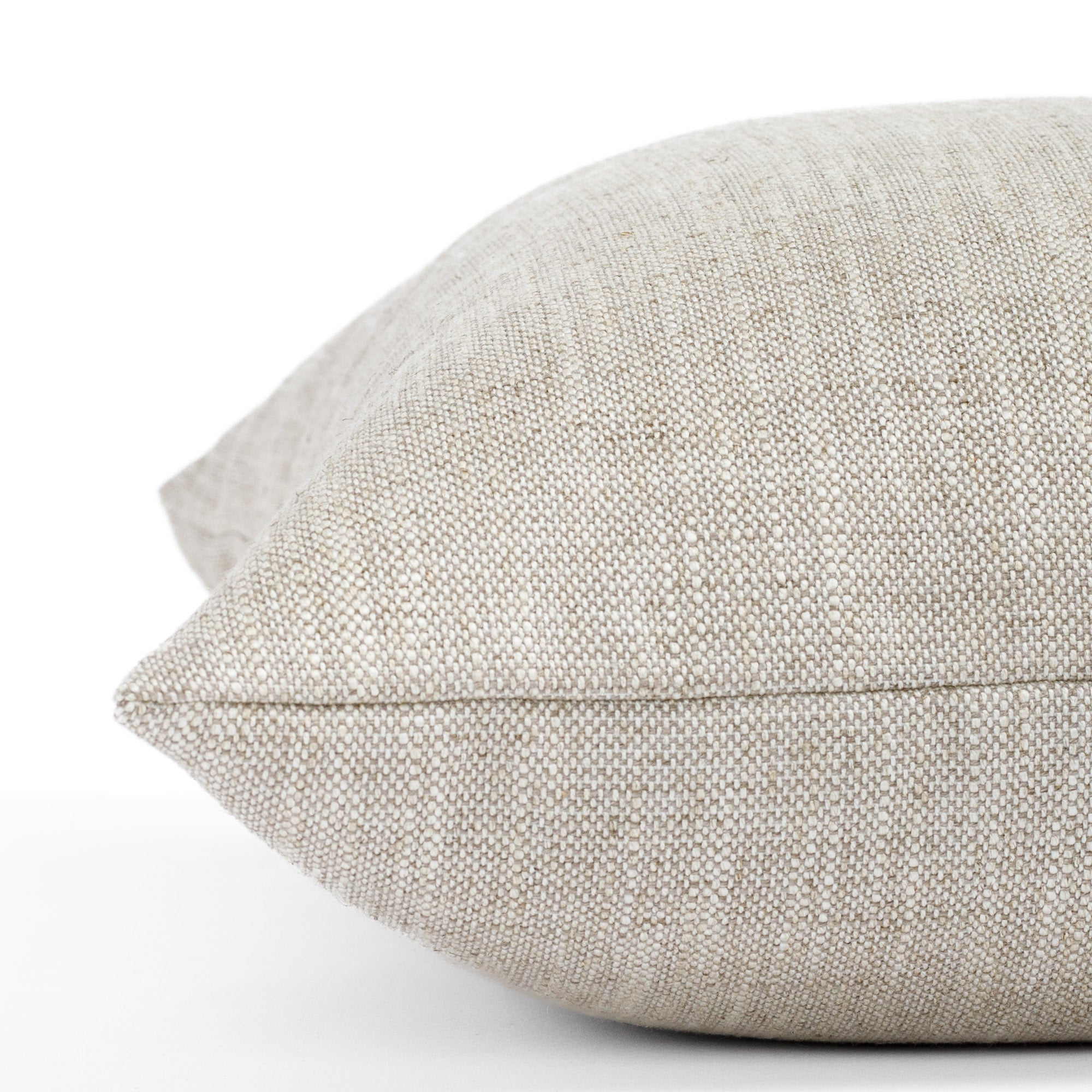 a beige linen blend throw pillow : close up side view