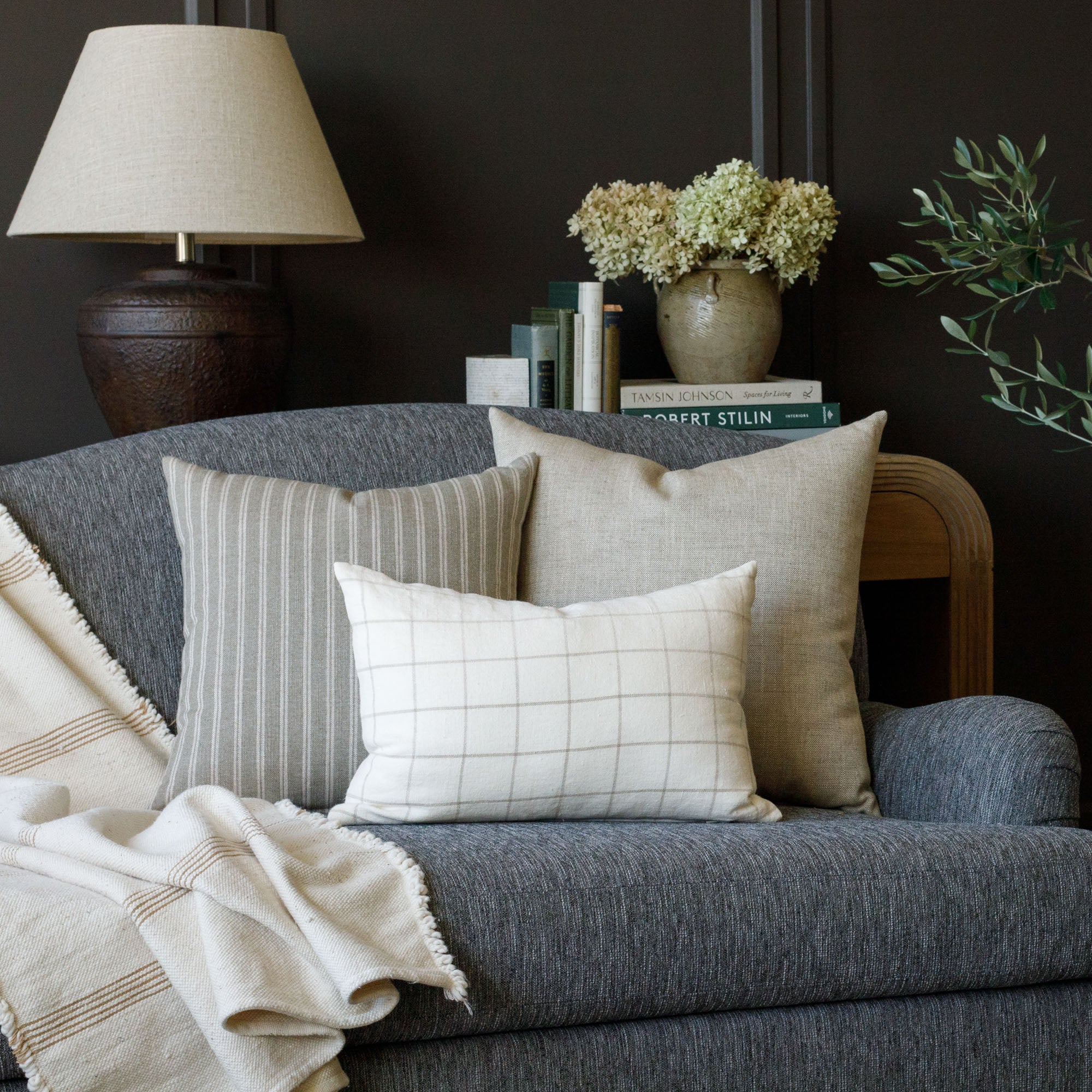 neutral Tonic Living home decor : butler cream check, conway stripe sage and brussels oatmeal throw pillows on a porter sable upholstered sofa