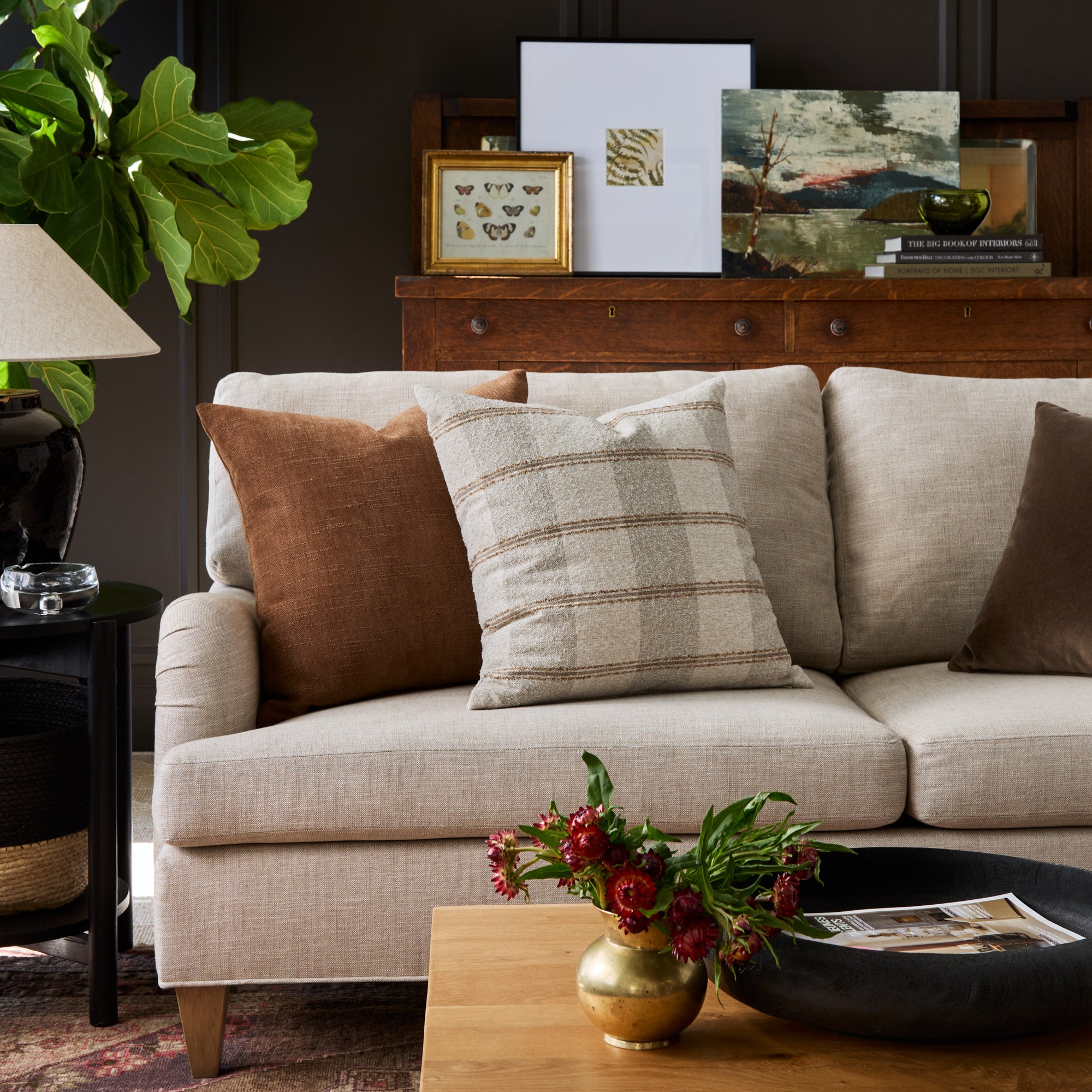 Sofa styled with Buckley Wheat 22x22 pillow and Blaine Cinnamon brown pillow – Tonic Living