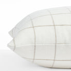 a cream and beige windowpane linen throw pillow : side view