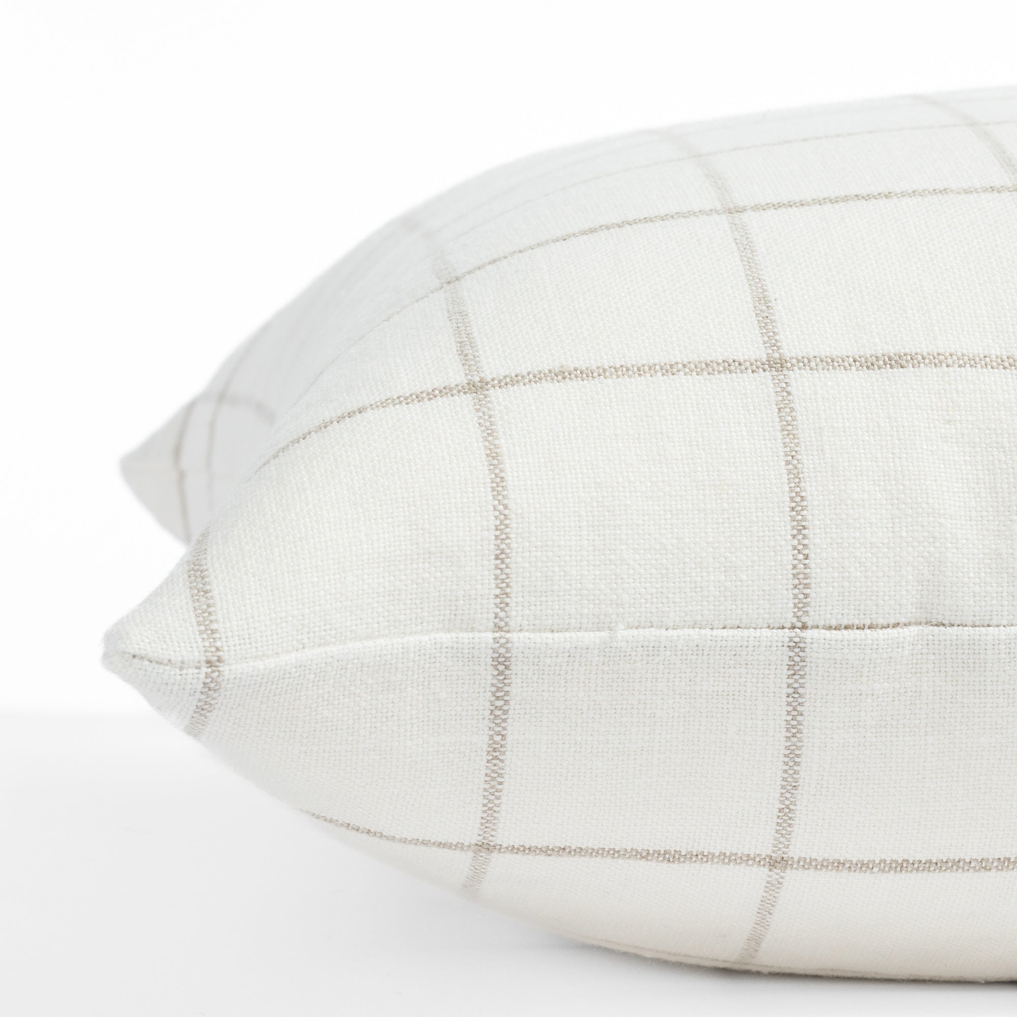 a cream and beige windowpane linen throw pillow : side view