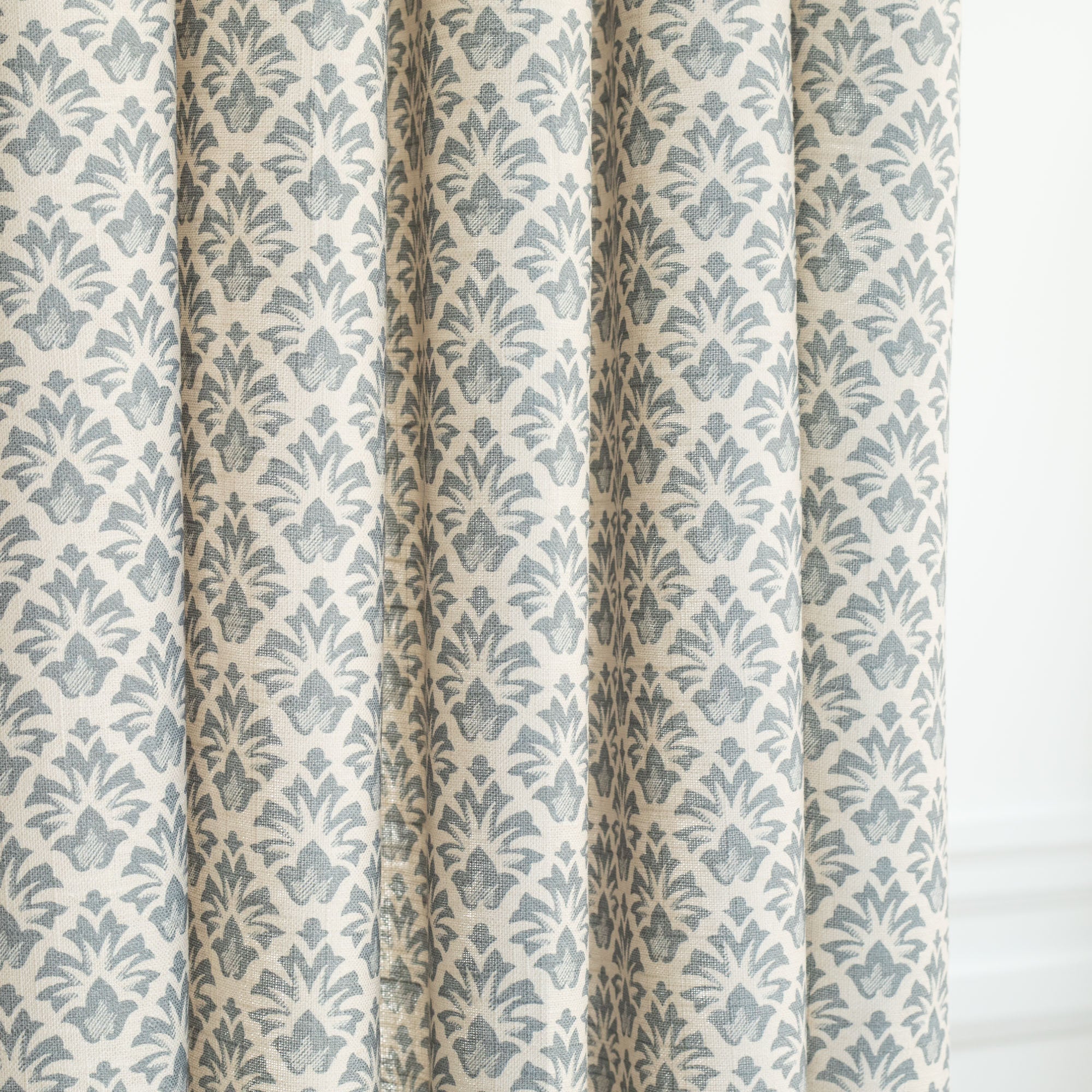 an earthy blue and sandy cream floral block print curtain fabric from Tonic Living
