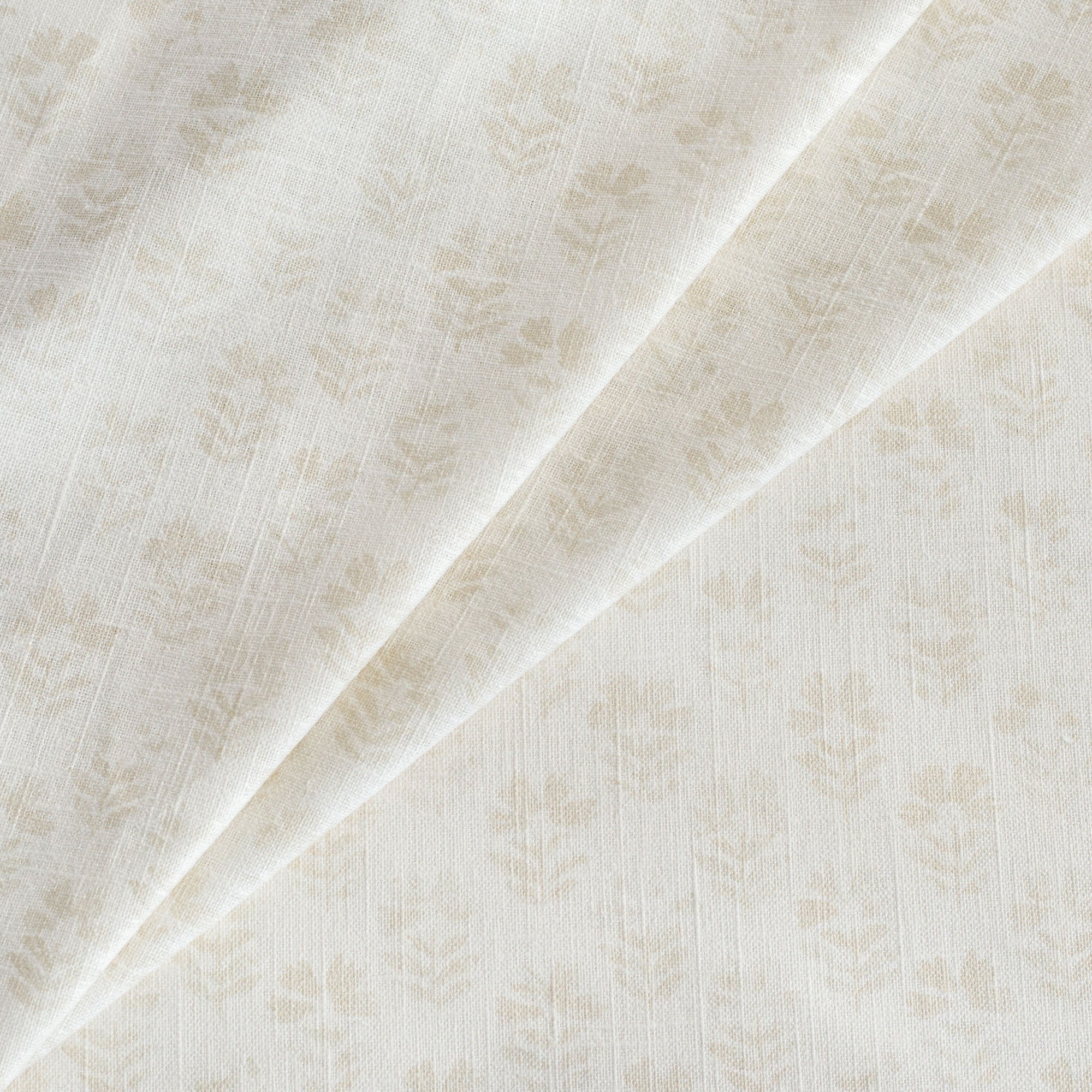 Carmel Fabric Parchment, a neutral cream subtle block-print style floral print drapery fabric from Tonic Living
