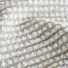 a wheat beige and white nubby textured high performance upholstery fabric : close up view