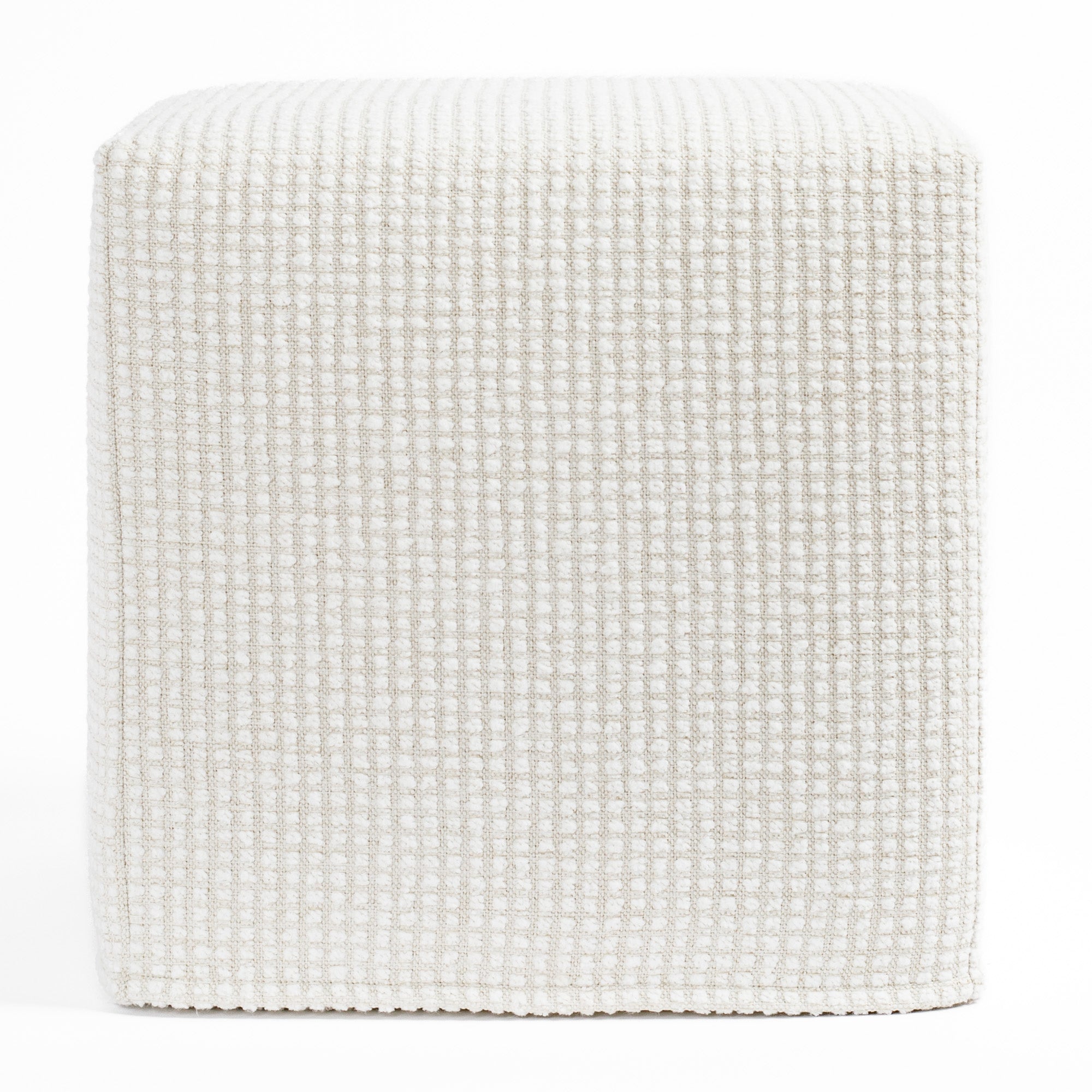 a cream textured grid patterned high performance fabric cube ottoman : front view