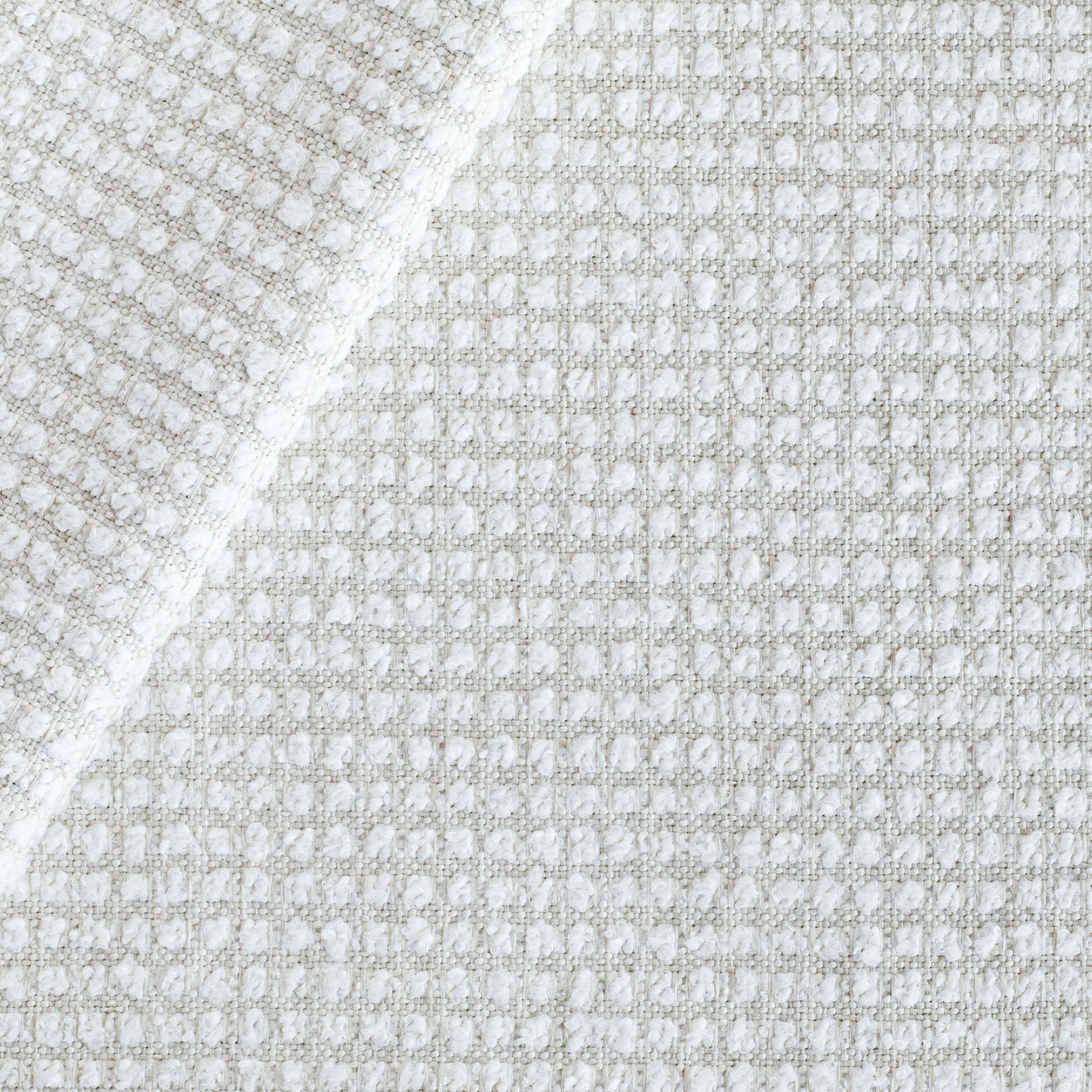 Carter Pearl, a creamy white nubby grid pattern high performance upholstery fabric from Tonic Living 