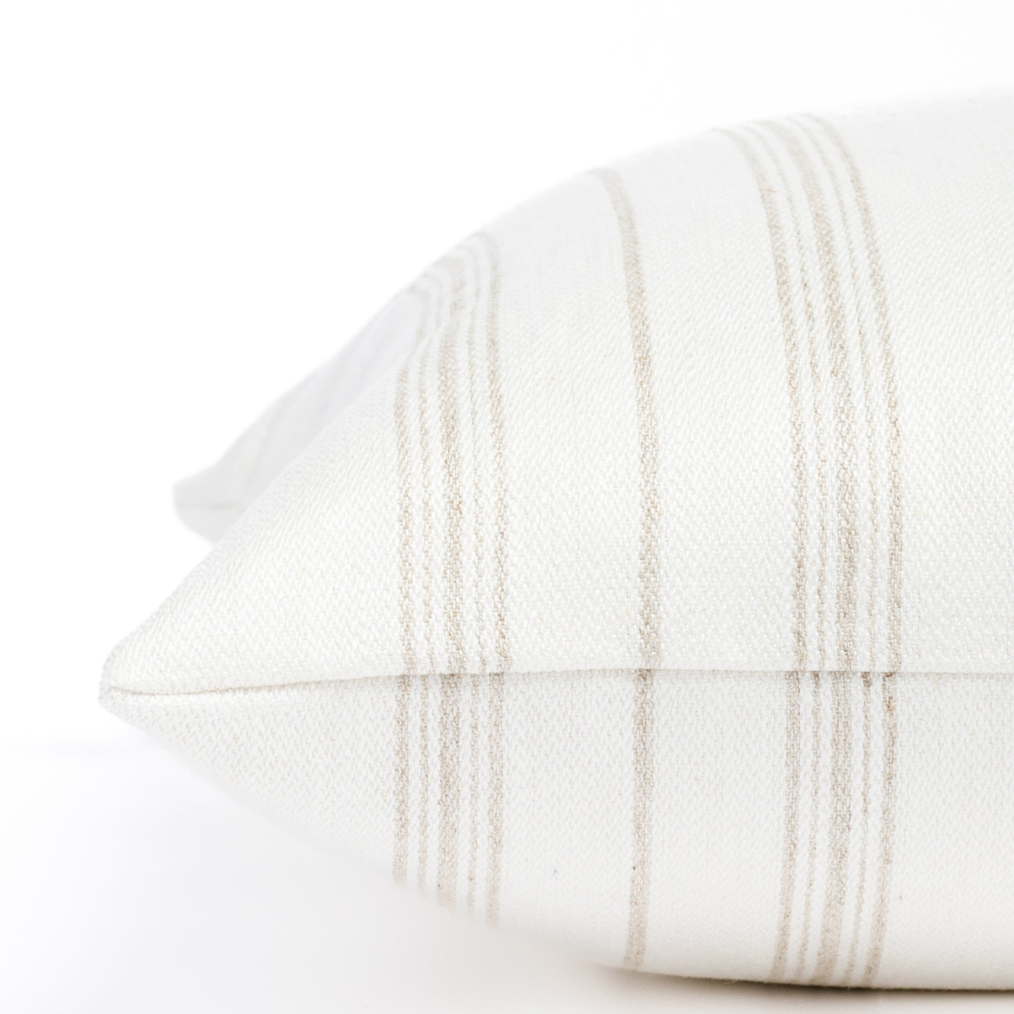 a flax beige and white striped throw pillow : side detail