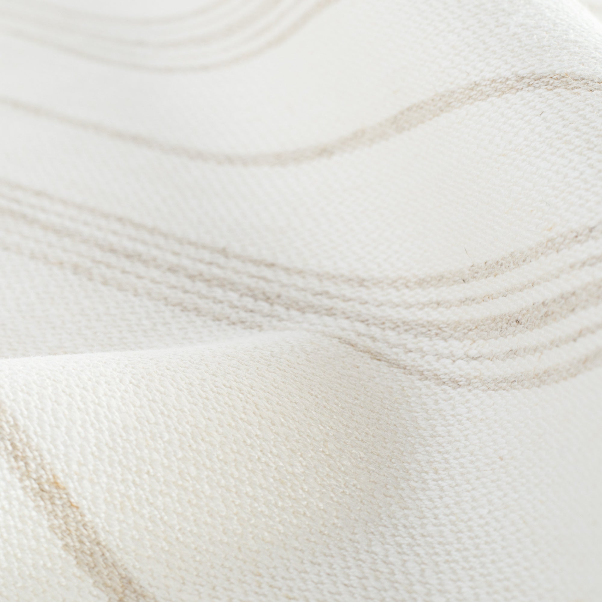 a white and beige vertical striped linen blend fabric : close up view