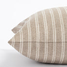 a light brown and oatmeal beige vertical stripe throw pillow : close up side view