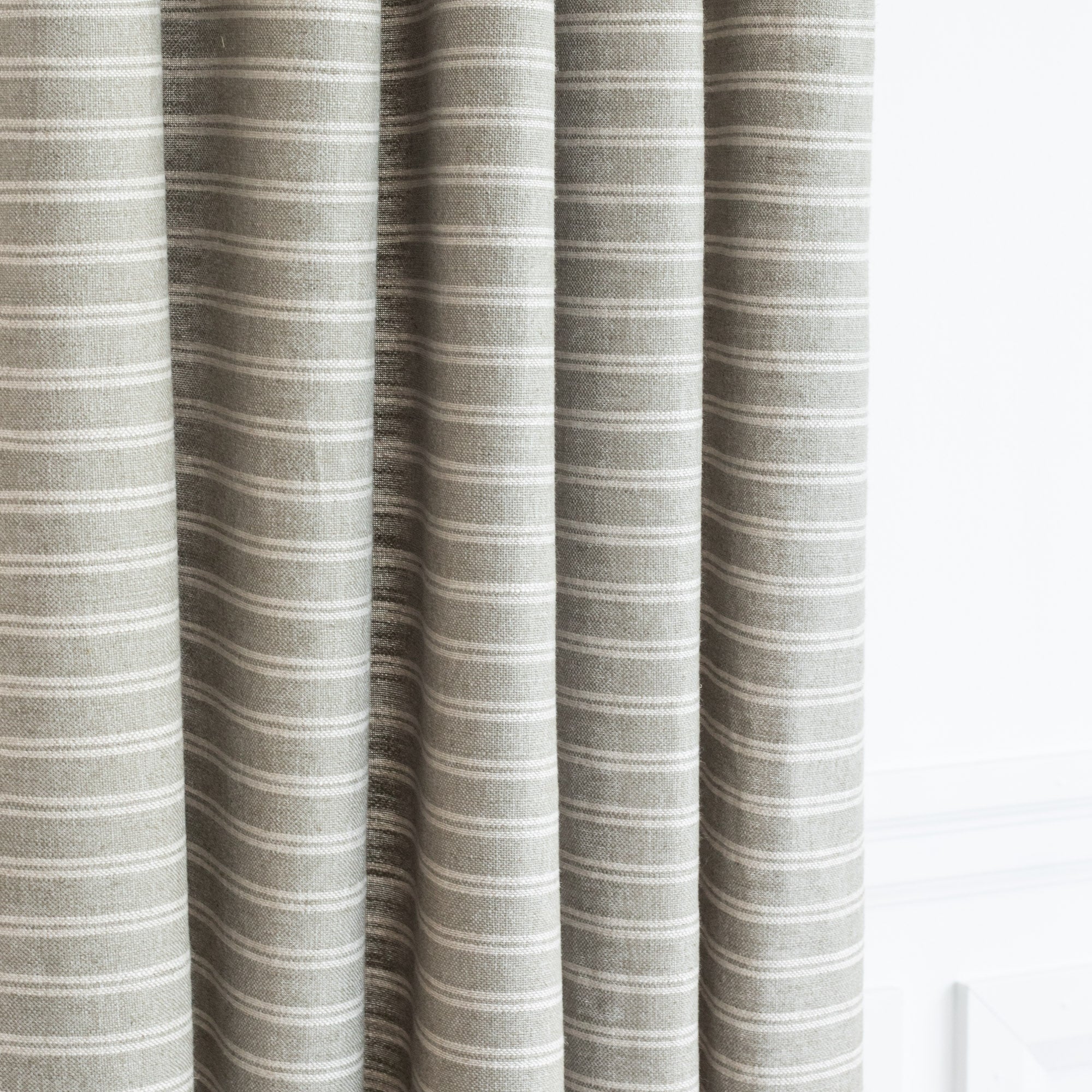 a sage green and cream horizontal stripe drapery fabric