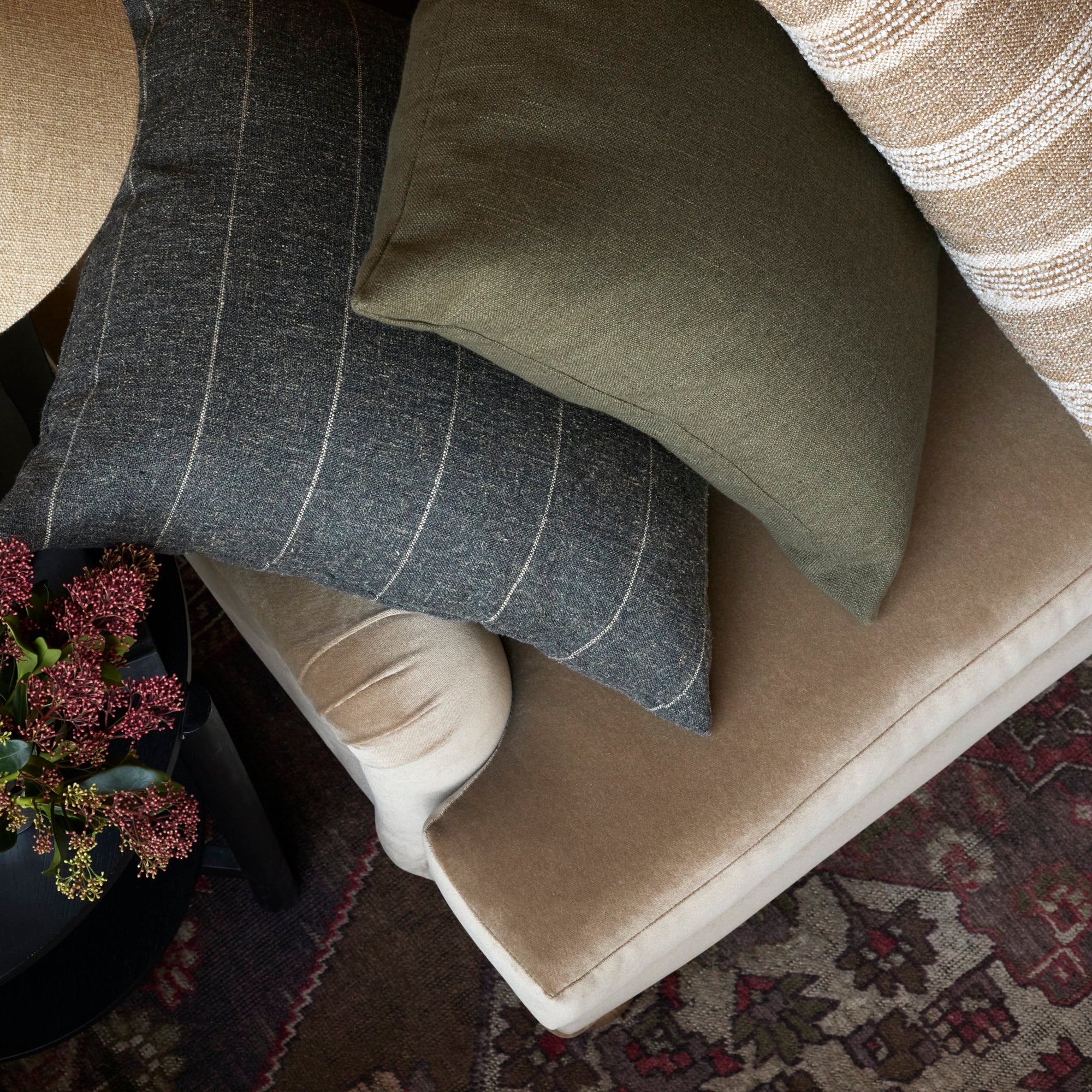 A stack of 3 textured throw pillows from Tonic Living.