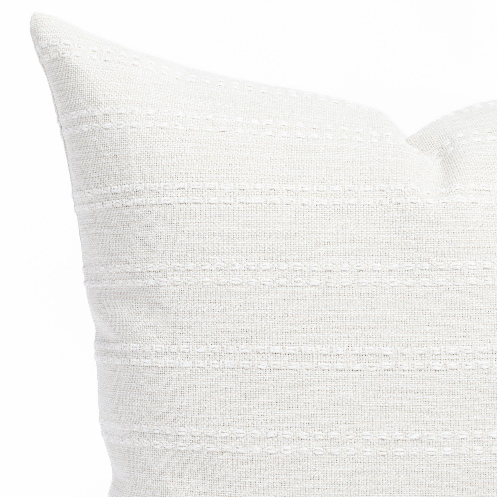 a soft white tonal stripe throw pillow: close up view