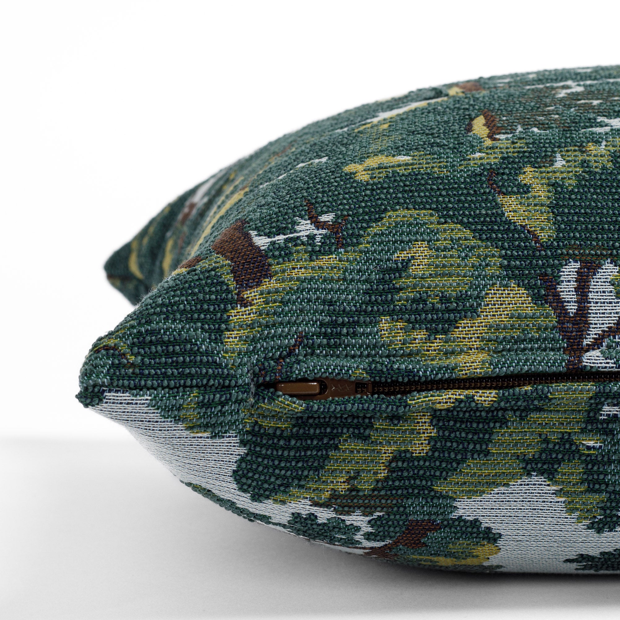 a forest jacquard tapestry patterned lumbar pillow: close up zipper view