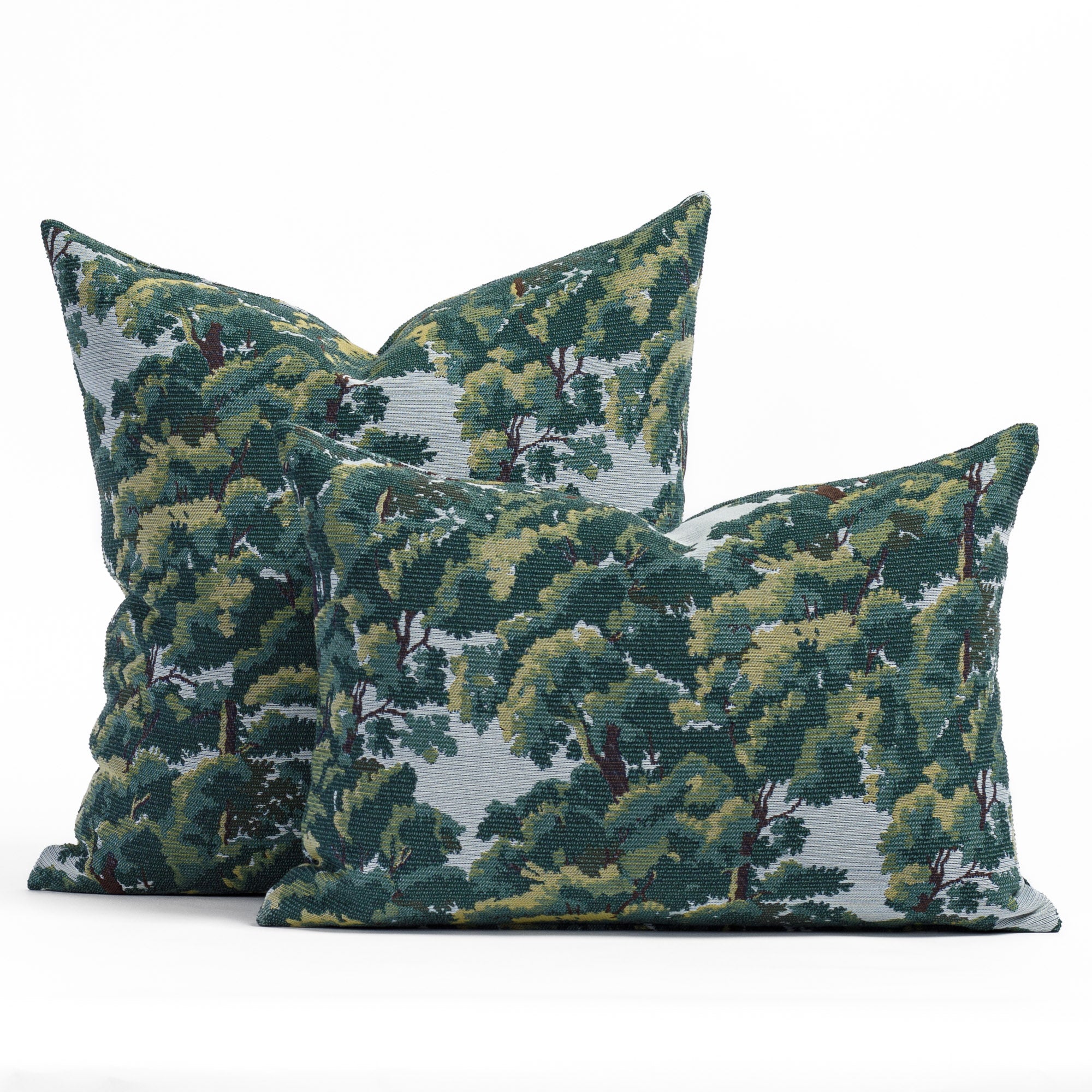 Elora heritage forest tapestry jacquard in an earthy palette of deep forest green, bark brown, and hazy sky blue patterned throw pillows shown in two sizes