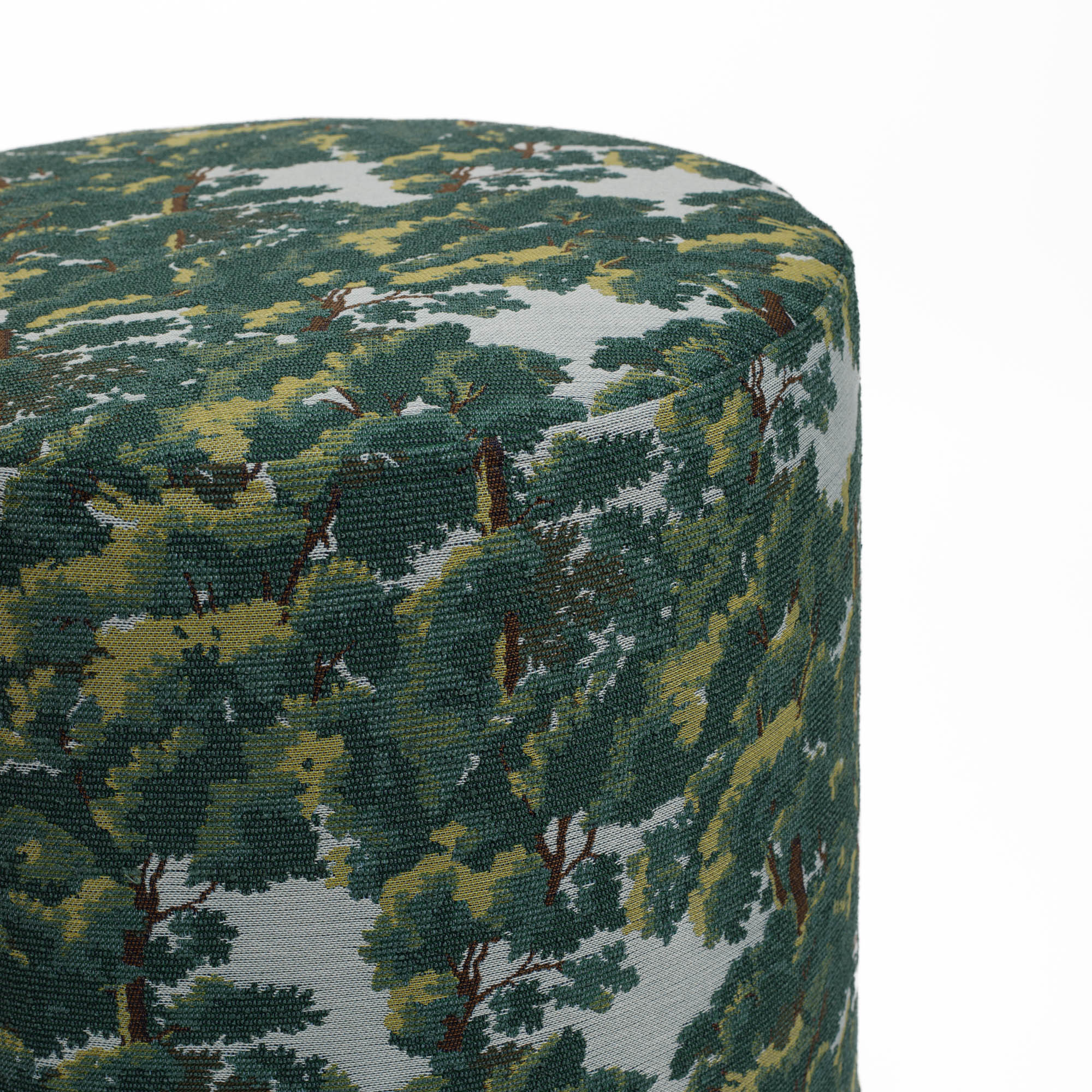 Zoomed-in image of the high-performance Elora fabric from Tonic Living, with vintage-style forest detailing in rich green and sky blue.