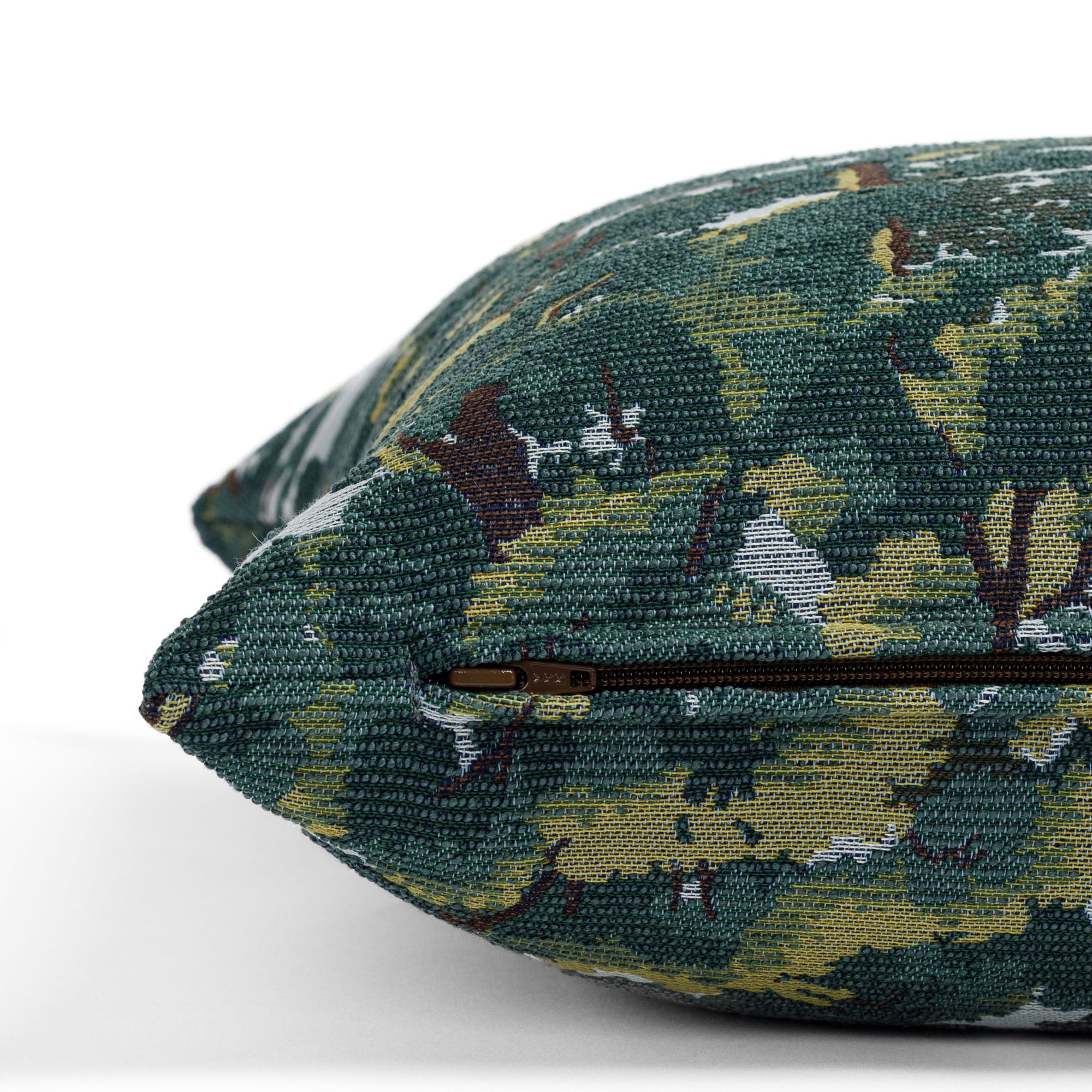 a forest tapestry patterned throw pillow : close up zipper view