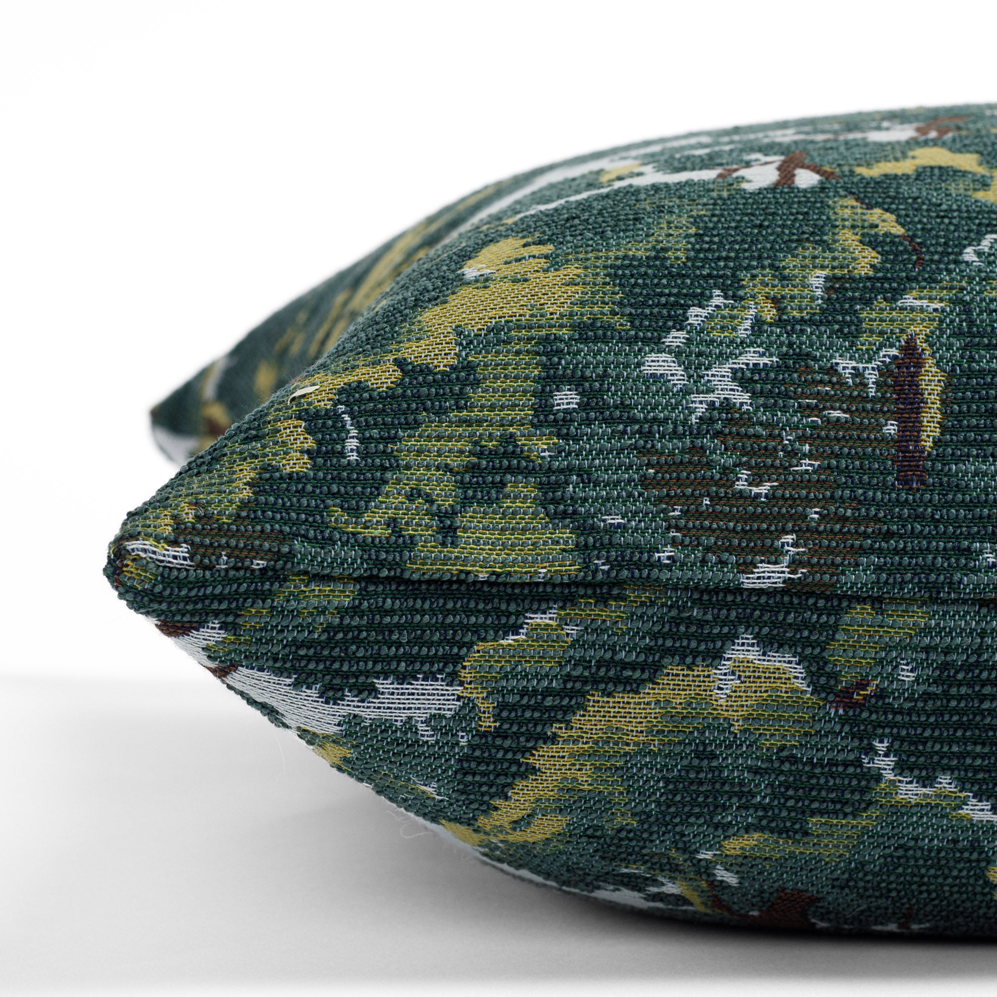 a forest tapestry patterned throw pillow : close up side view