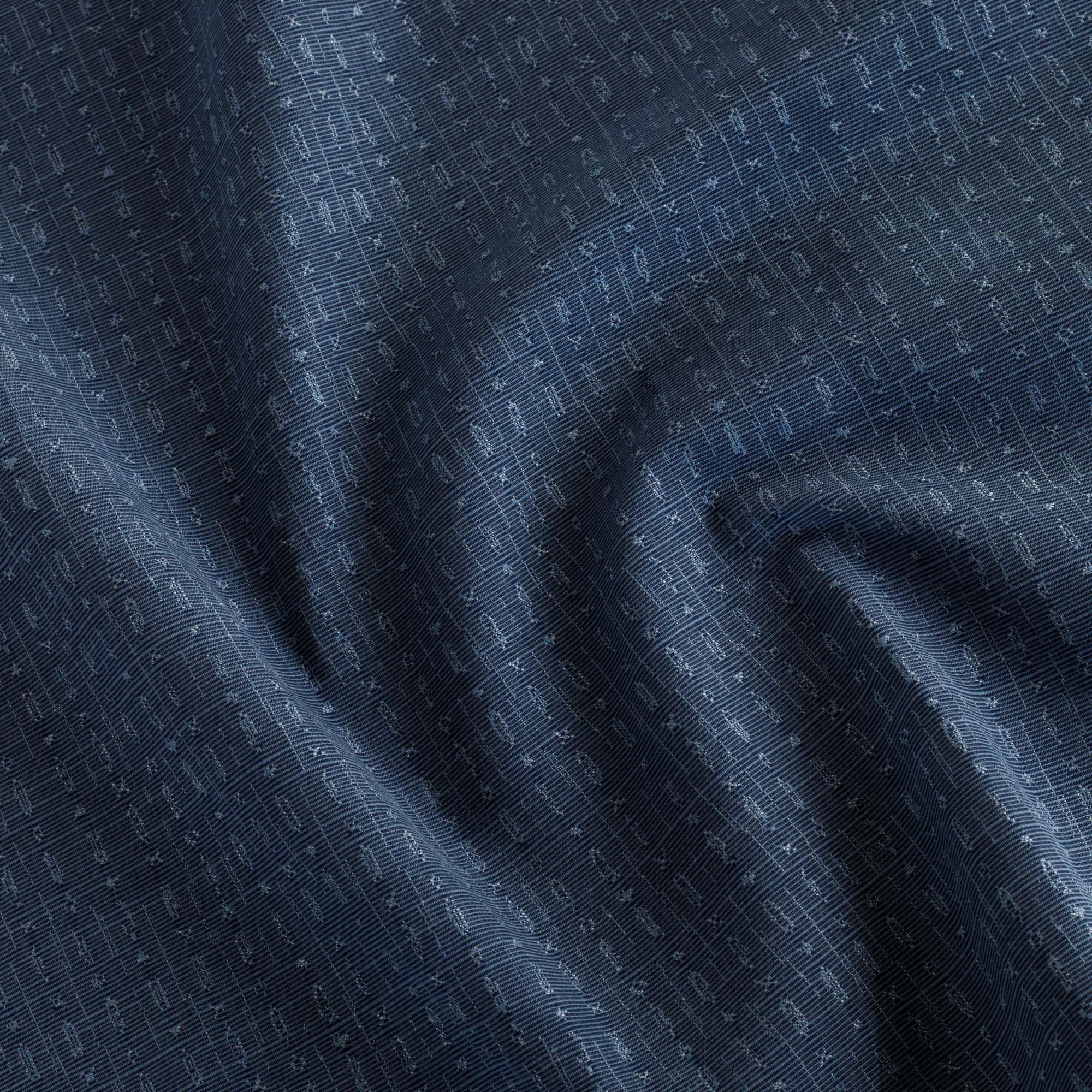 Embrace Indigo Sunbrella Outdoor Fabric from Tonic Living, a deep blue upholstery fabric with an abstract tone-on-tone pattern.