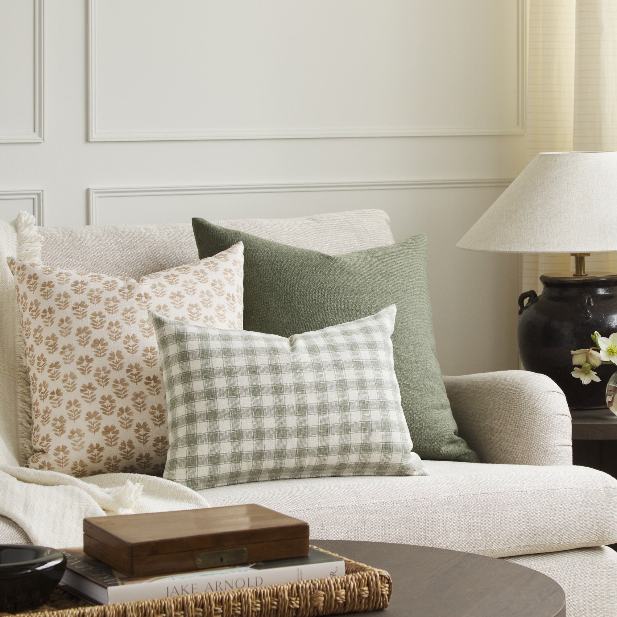 Tonic Living Emmett Plaid sage lumbar cushion styled with Carmel 20x20 Pillow in Umber and Loden 22x22 Pillow in Sage.