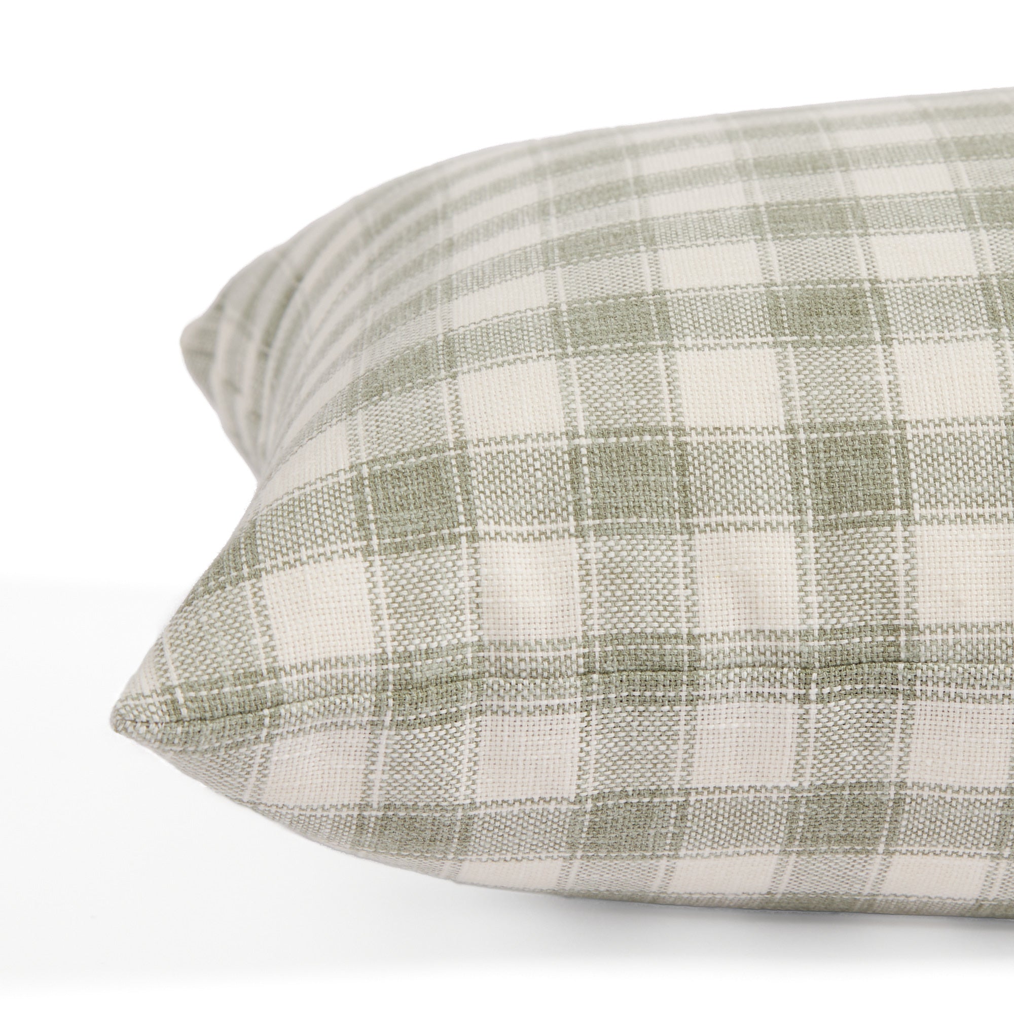 Side view of Tonic Living Emmett Plaid decorative lumbar cushion highlighting its soft green check design.