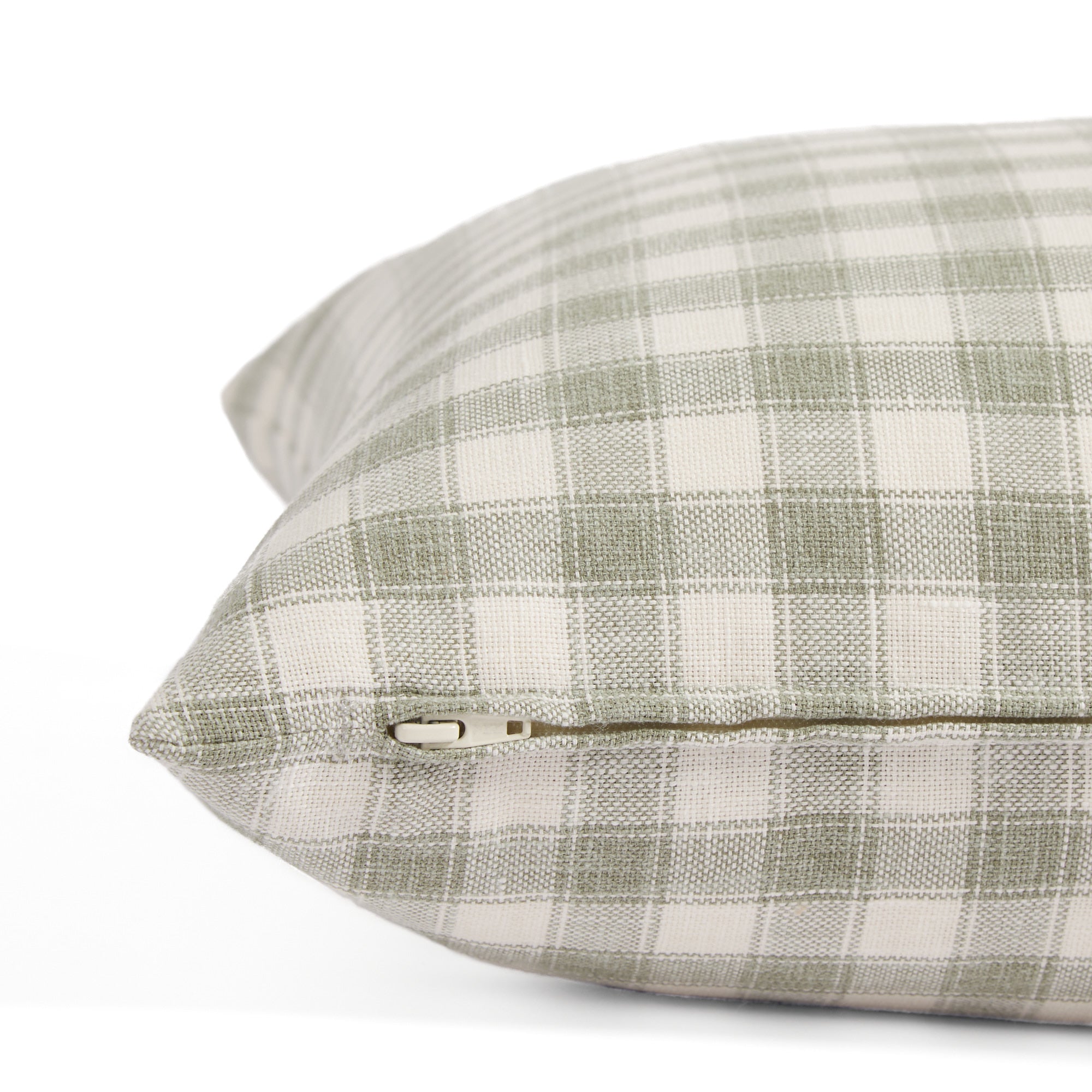 Side zipper detail of Tonic Living Emmett Plaid 20x20 pillow in light green and white plaid.