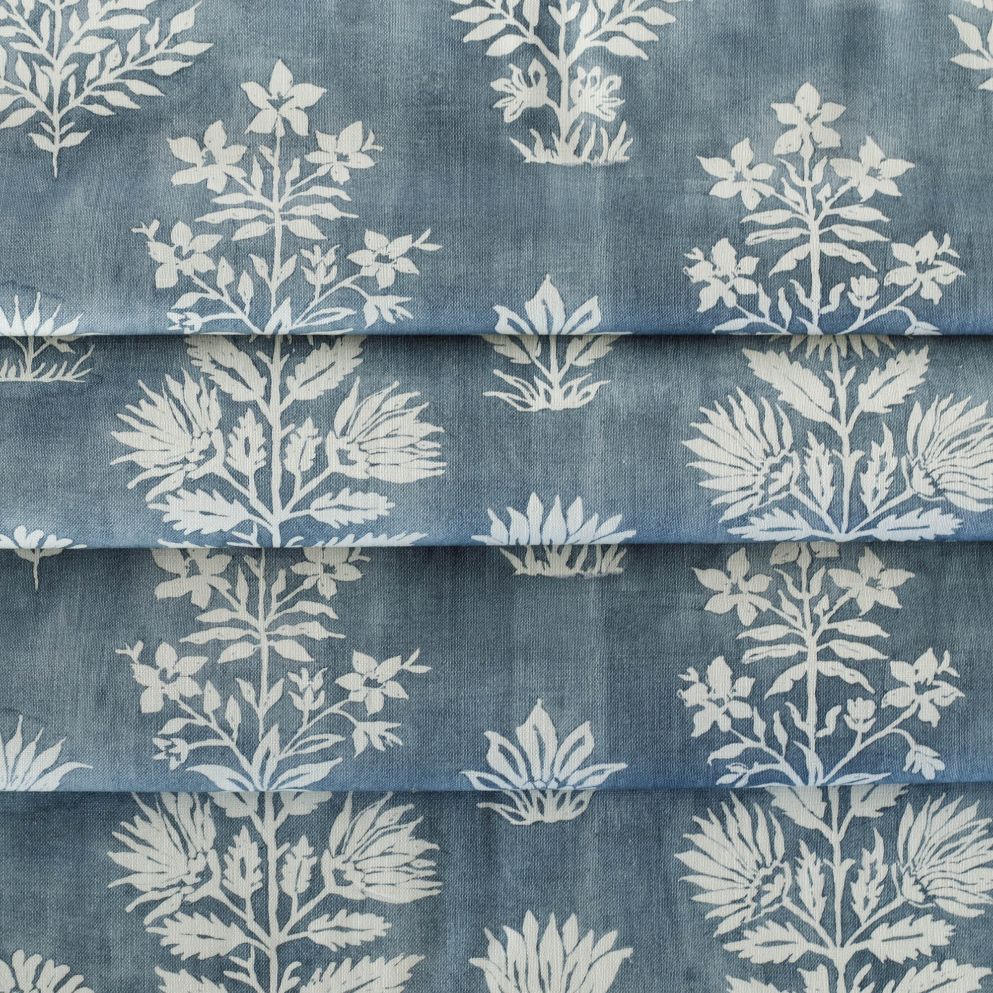 a watery indigo blue and white floral print fabric : close up view 2
