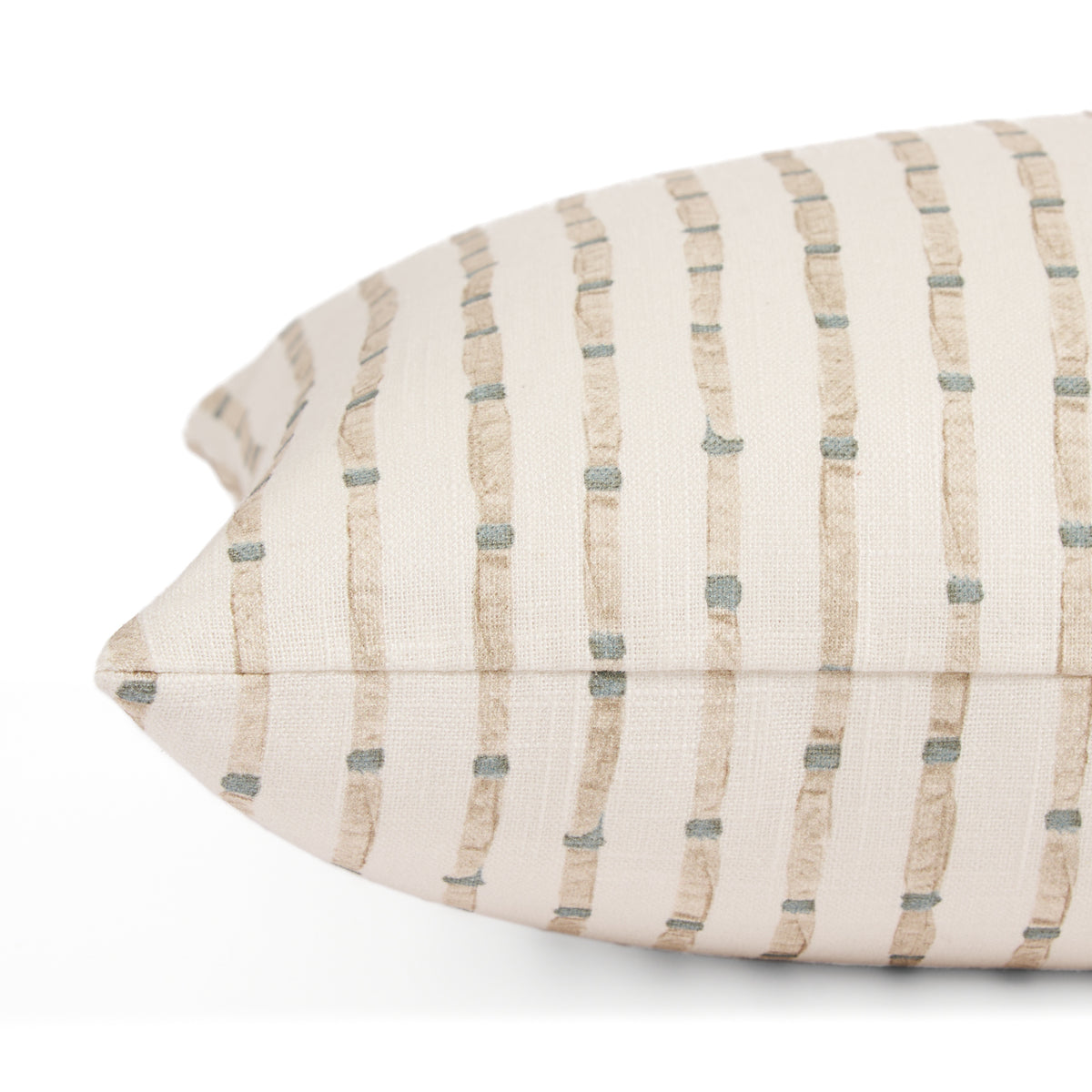 Side view of Tonic Living Hadley Stripe Mist lumbar cushion highlighting its blue and brown organic striped pattern.