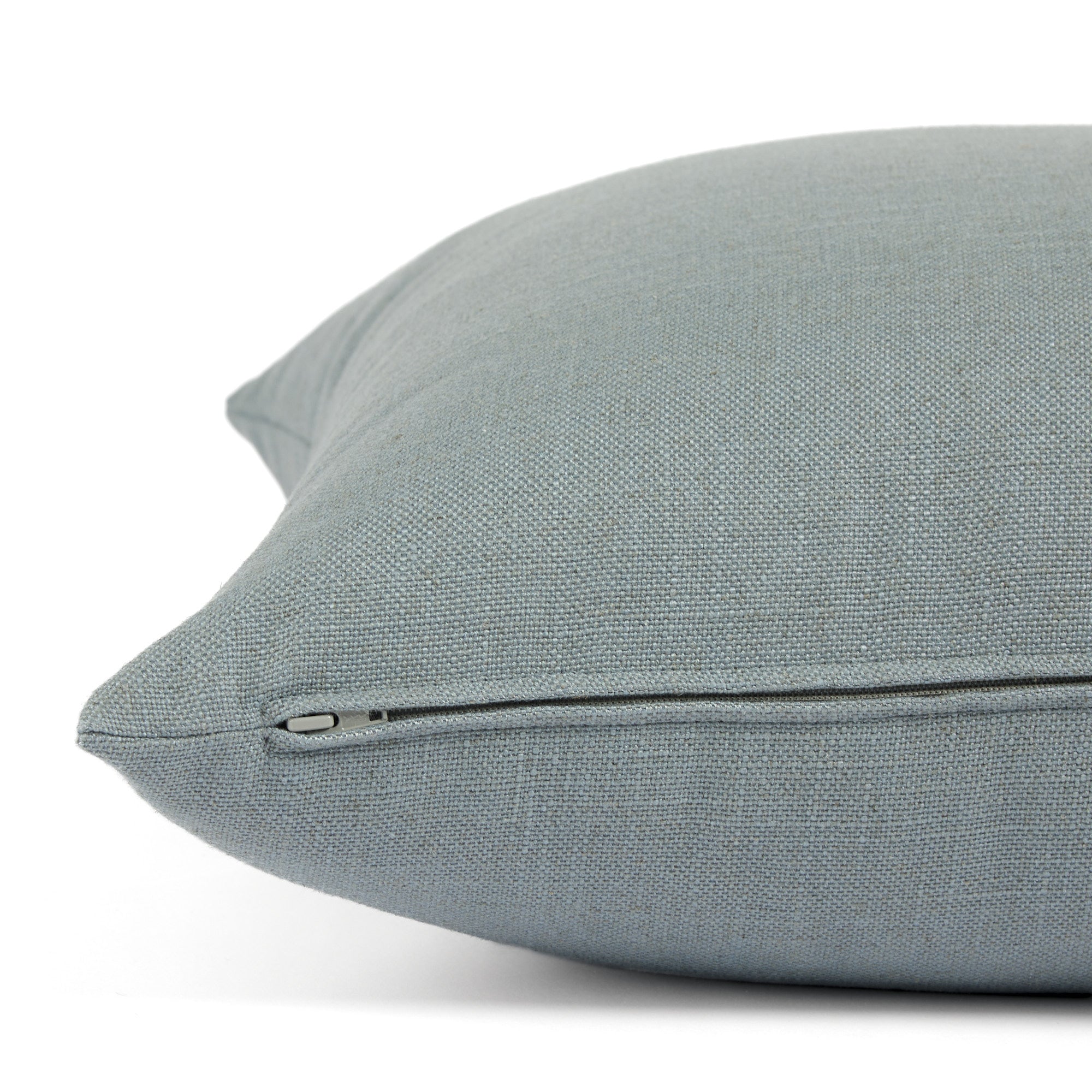 Side zipper detail of Tonic Living Hampton 24x24 throw pillow in chambray blue.
