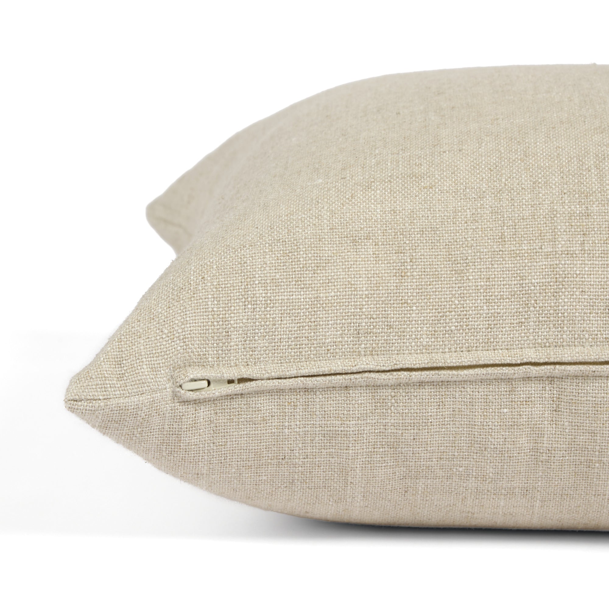 Side zipper detail of Tonic Living Hampton 22x22 throw pillow in soft oatmeal beige.