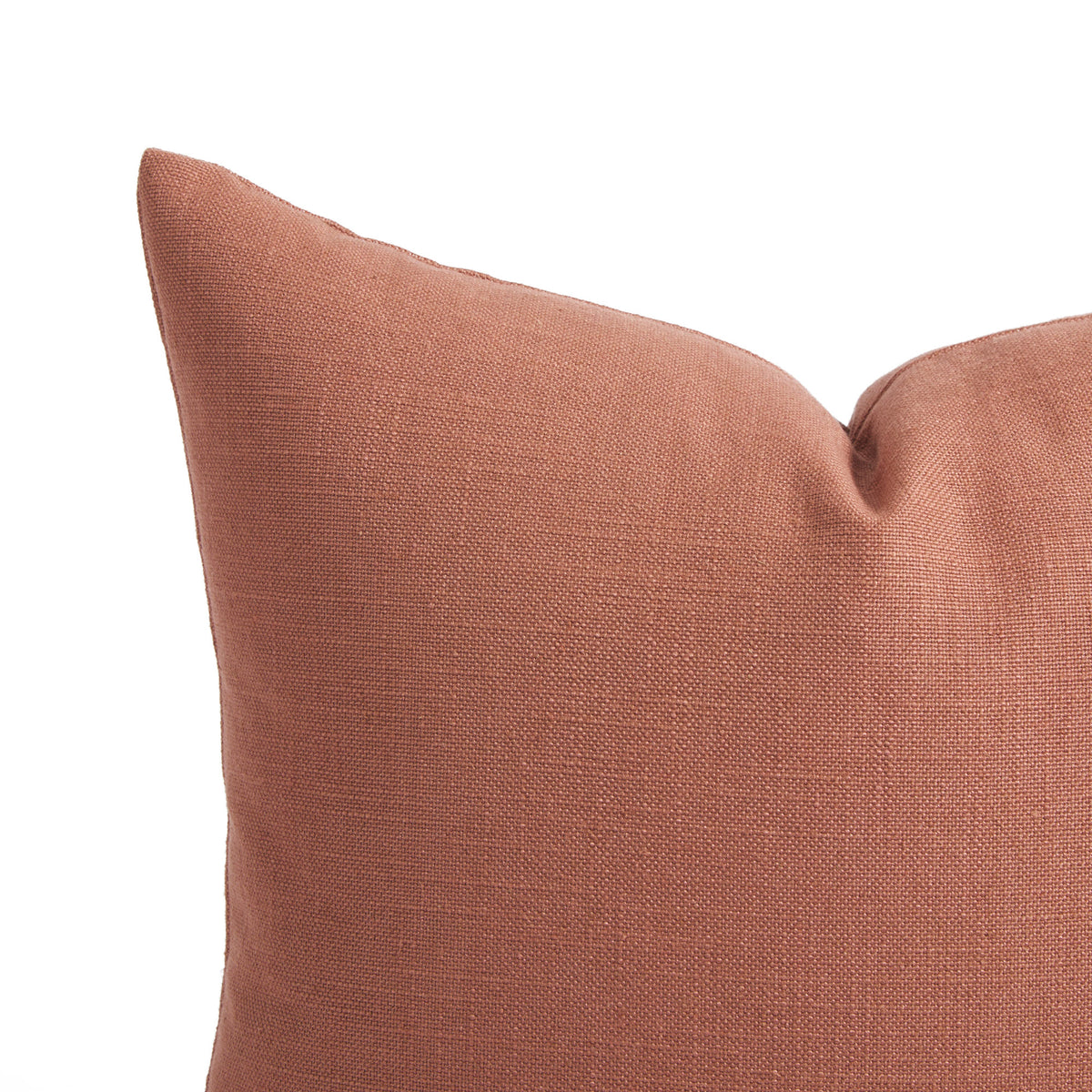 Close up of Tonic Living Hampton Rosewood pillow showing its earthy pink colour, terracotta tones, and linen-inspired woven texture.