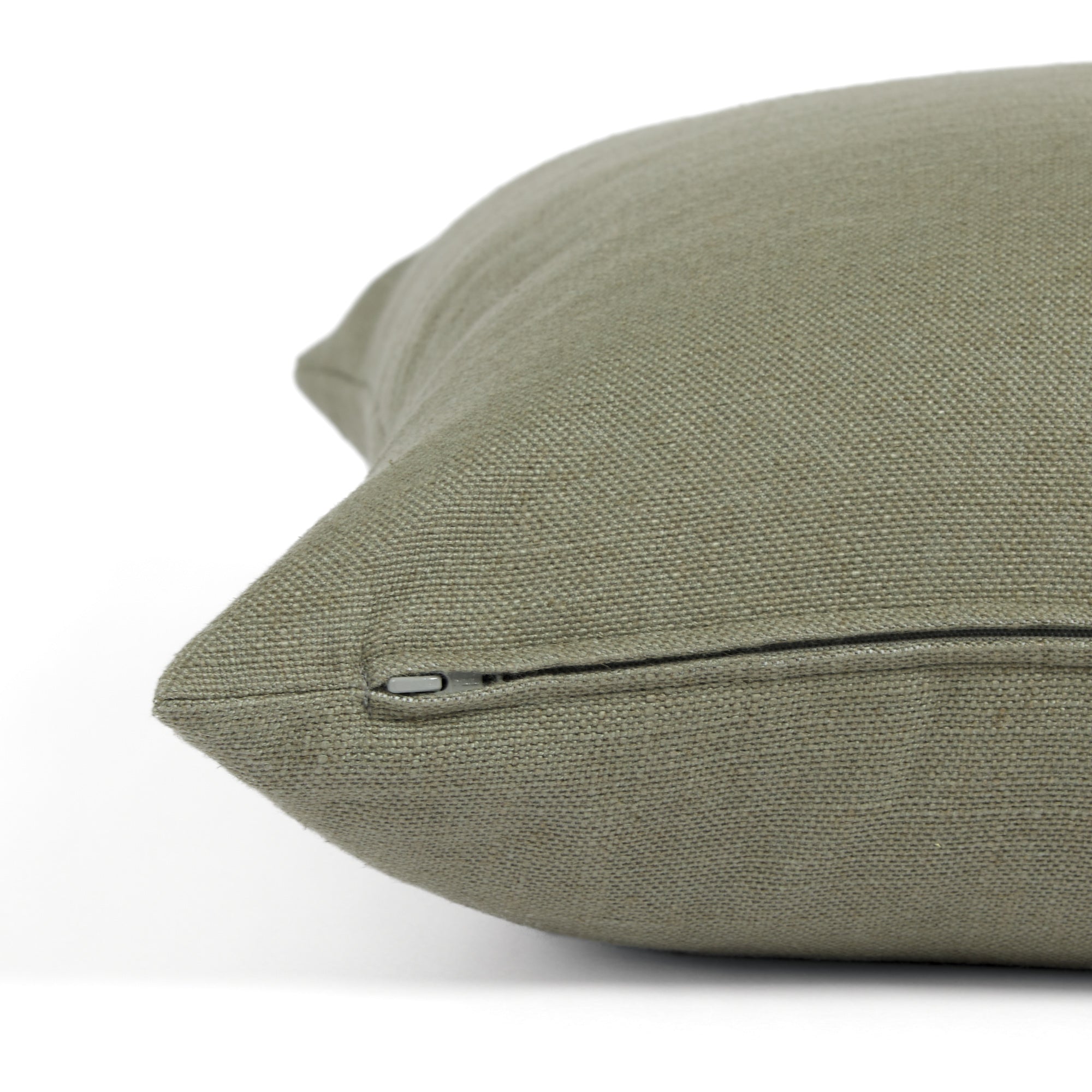 Side zipper detail of Tonic Living Hampton 22x22 throw pillow in muted sage green.